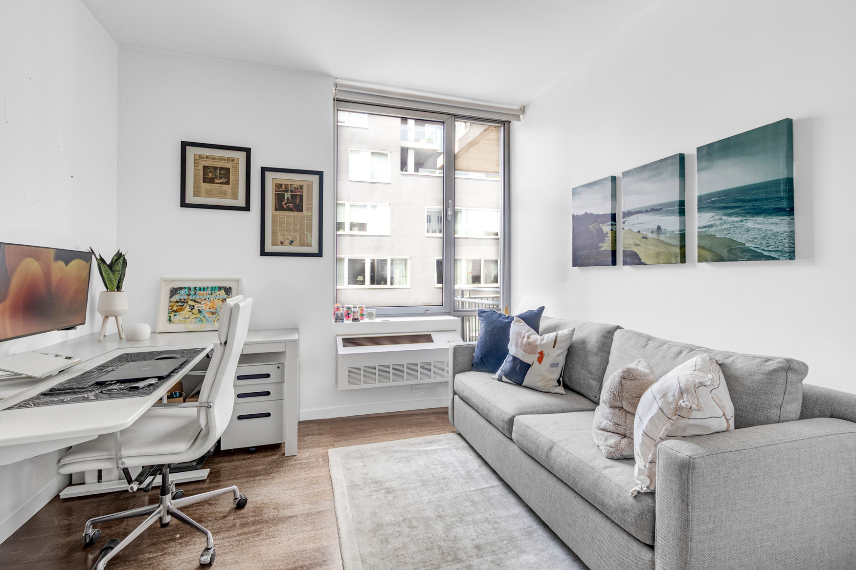 444 West 19th Street, Unit 701 Manhattan, NY 10011 - Photo 7 of 11 a living room with furniture and a window