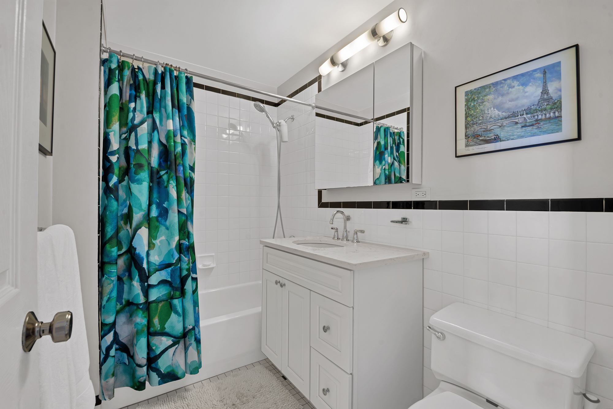 8 Mt Morris Park West, Unit C Manhattan, NY 10027 - Photo 10 of 12 a bathroom with a toilet a sink and a mirror