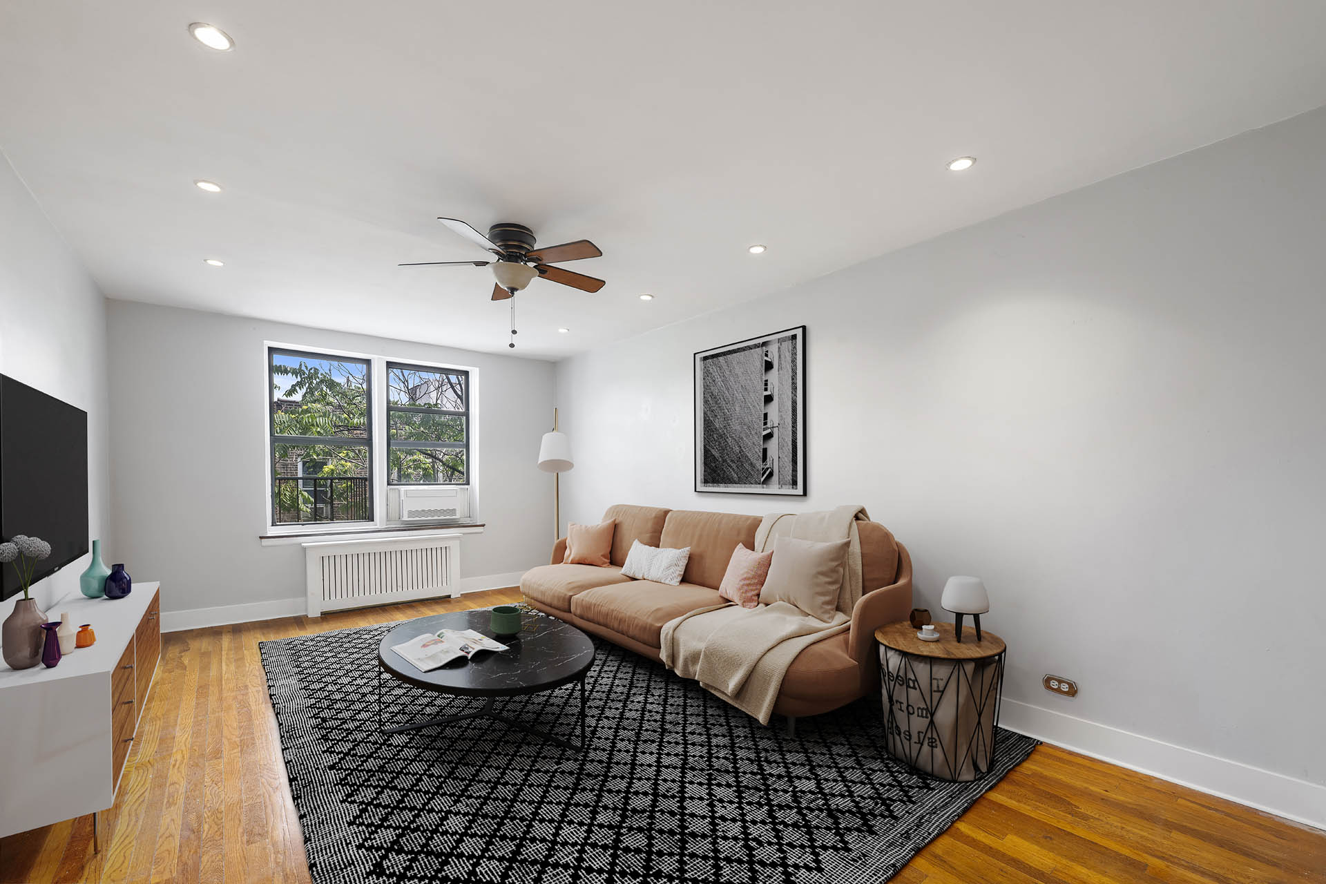2420 Morris Avenue, Unit 6K Bronx, NY 10468 - Photo 2 of 7 a living room with furniture and a window