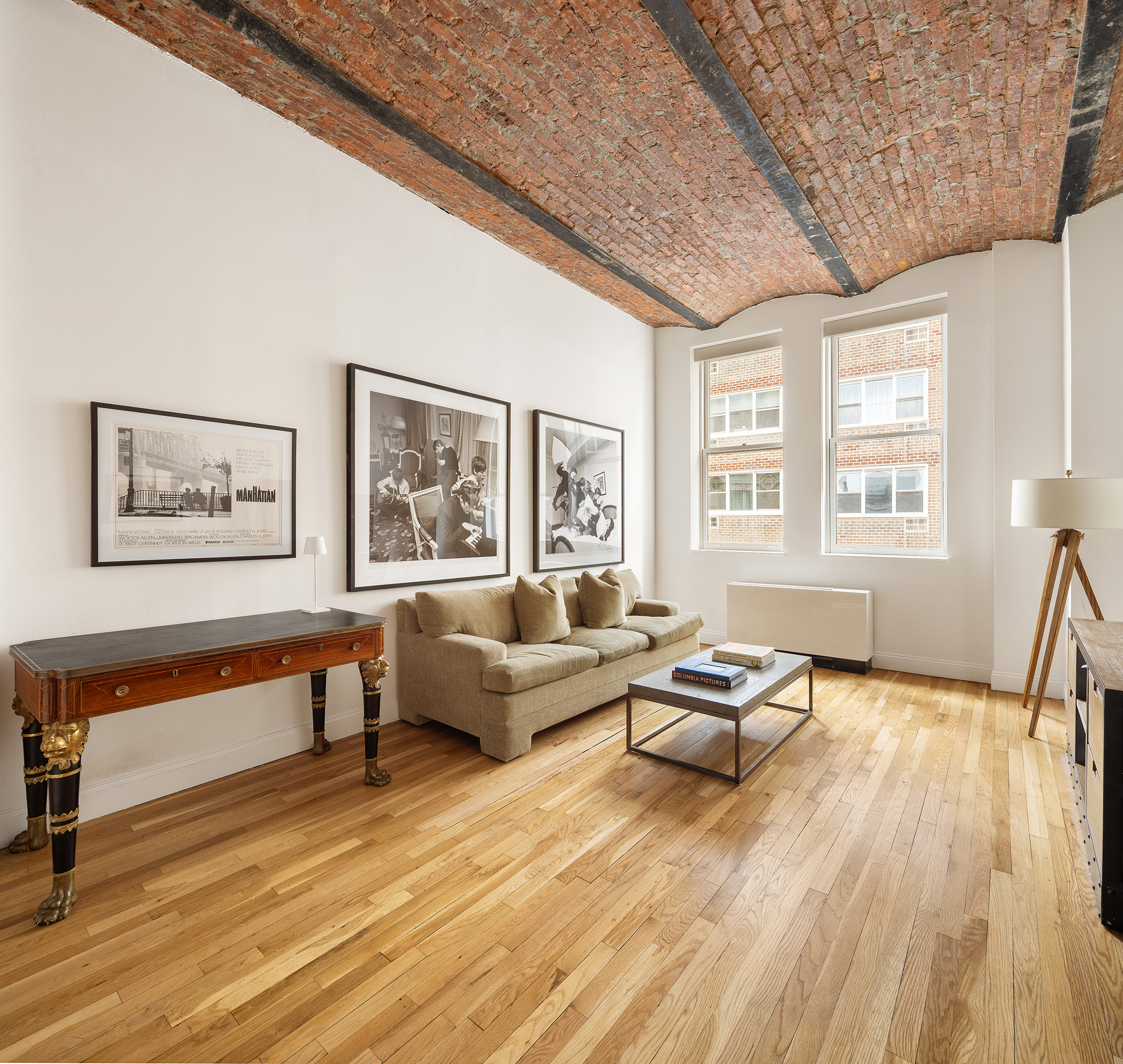 9 Barrow Street, Unit 6D Manhattan, NY 10014 - Photo 1 of 9 a living room with furniture and wooden floor
