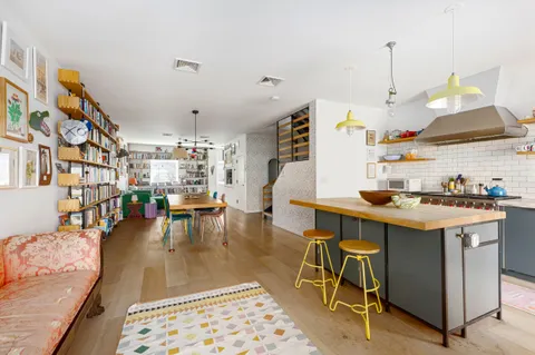 a view of a kitchen and dining room