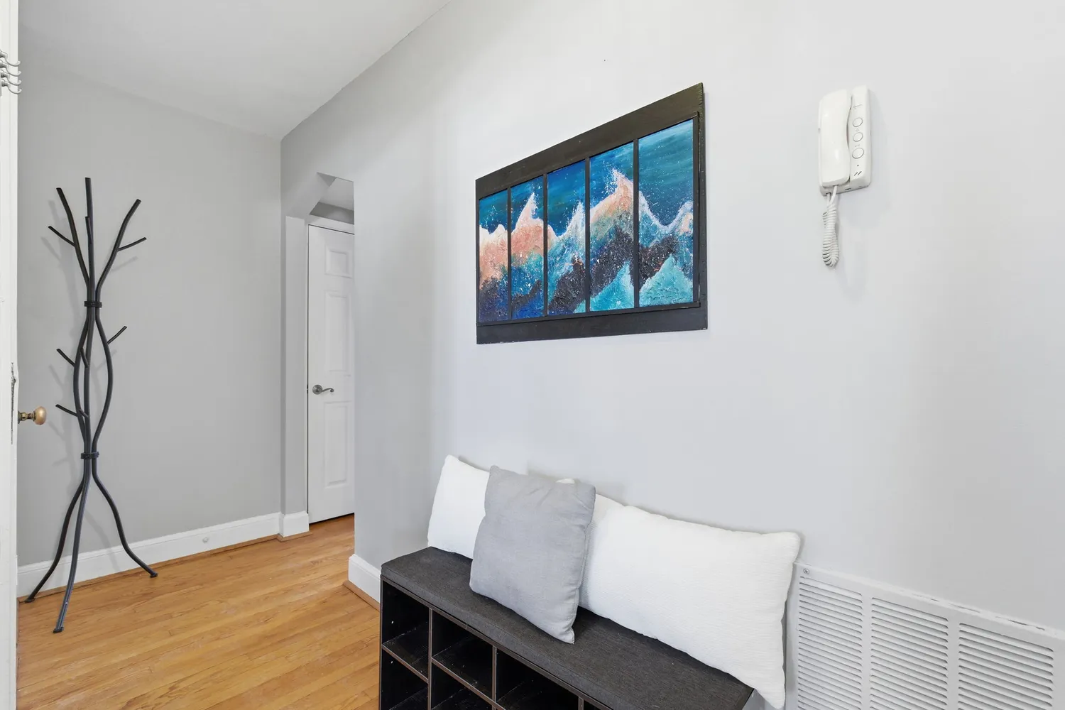 a view of a workspace with furniture and wooden floor