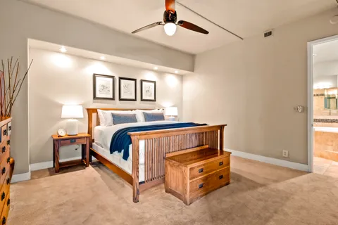 a bedroom with a bed and window
