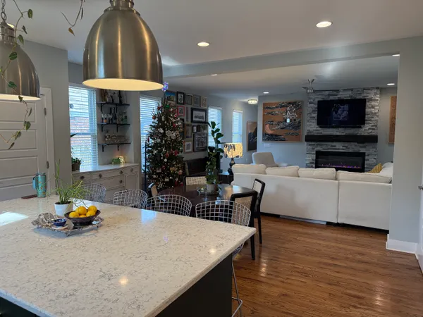 a view of a dining room with furniture and wooden floor