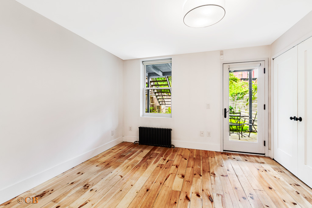 115 Lincoln Place, Unit 1 Brooklyn, NY 11217 - Photo 2 of 6 wooden floor in an empty room with a window
