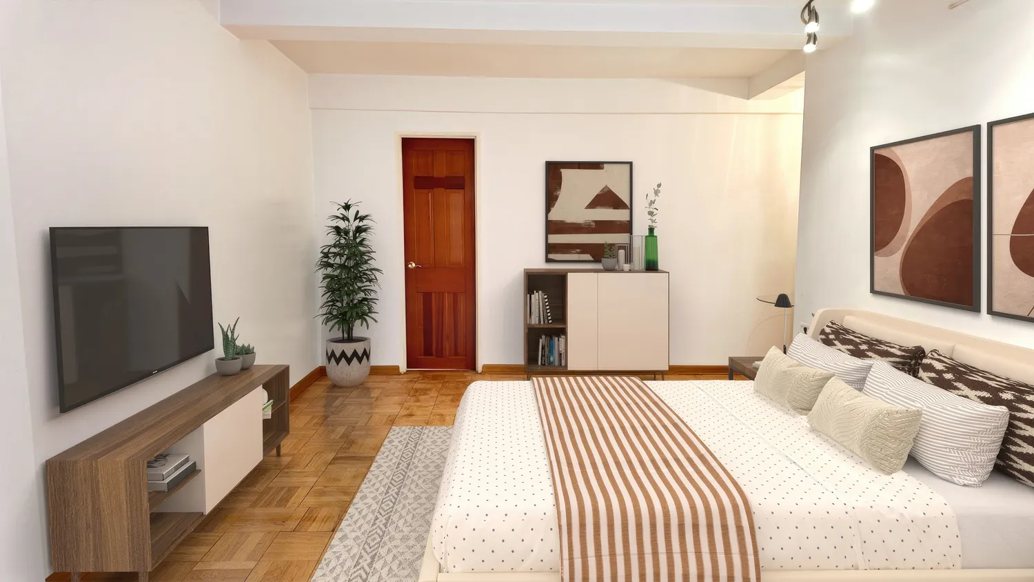 a bedroom with a bed and a flat screen tv