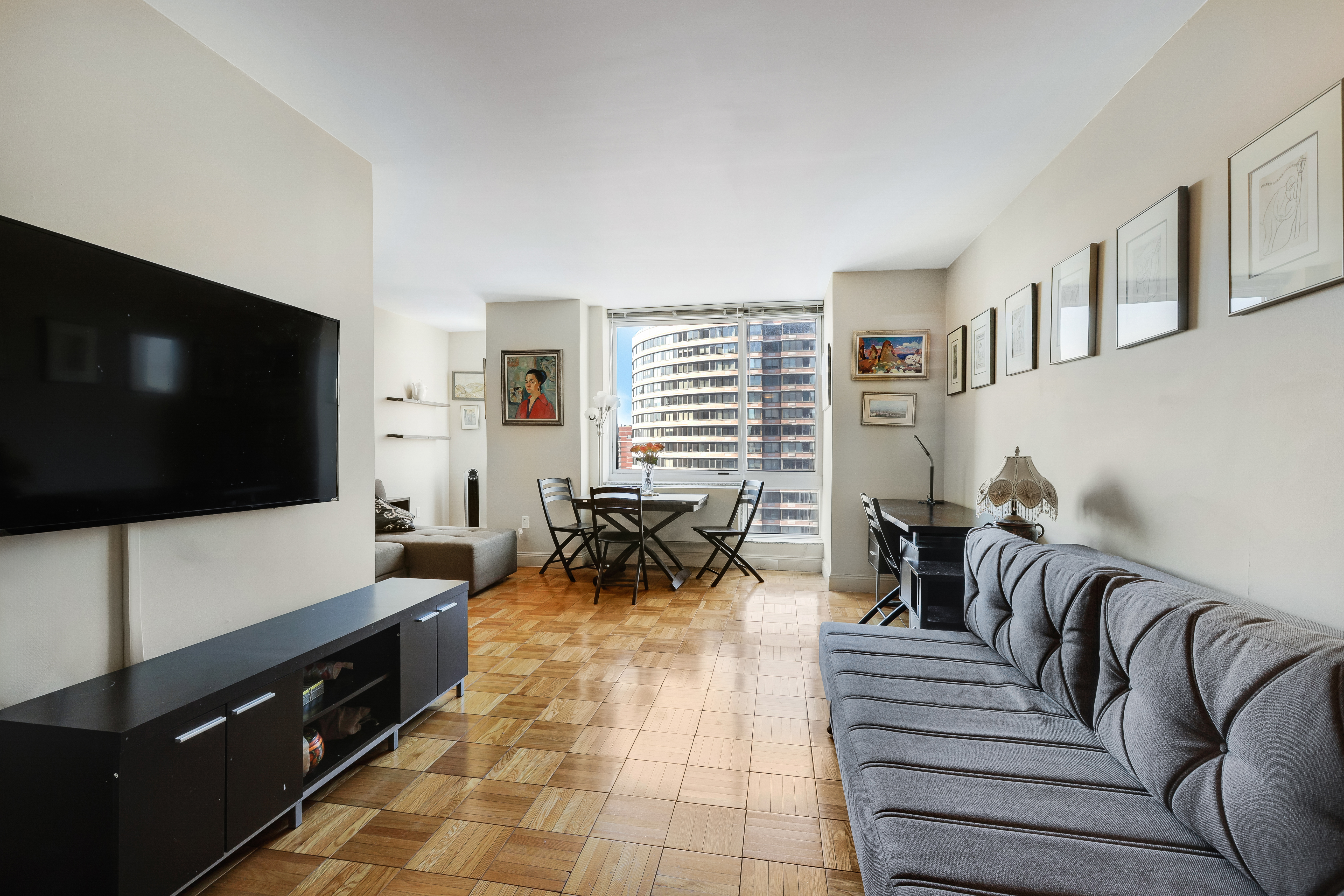 a living room with furniture and a flat screen tv