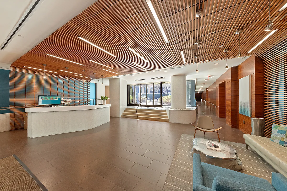 454 West 54th Street, Unit 7B Manhattan, NY 10019 - Photo 13 of 15 a view of a living room and kitchen