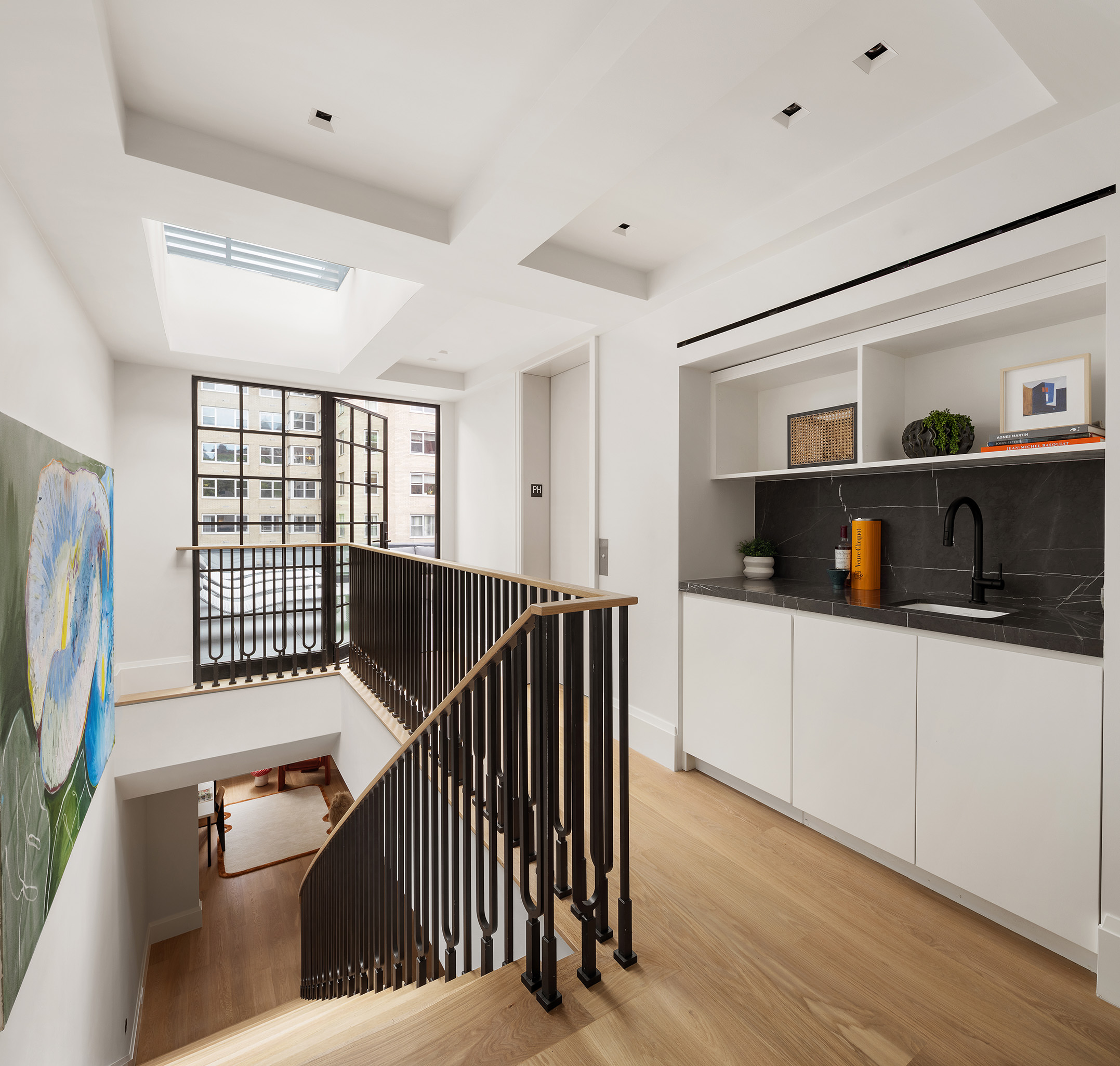 17 East 9th Street Manhattan, NY 10003 - Photo 28 of 32 a hallway with windows and wooden floor