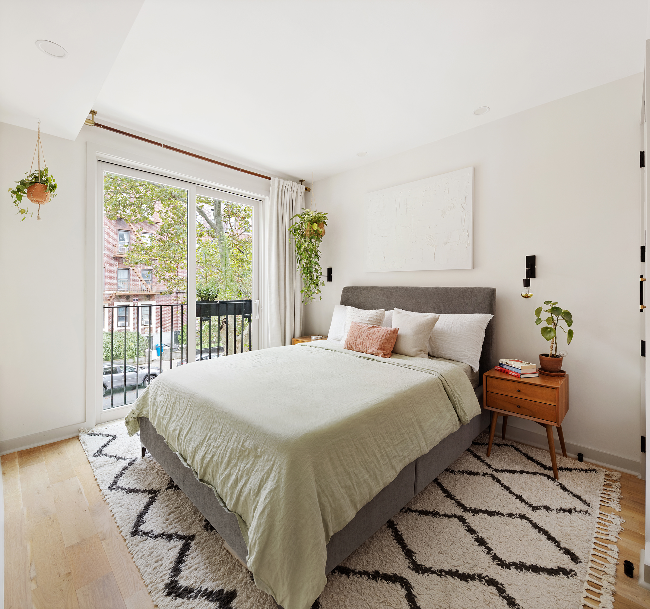 1015 A President Street, Unit 2F Brooklyn, NY 11225 - Photo 5 of 8 a bedroom with a bed and wooden floor