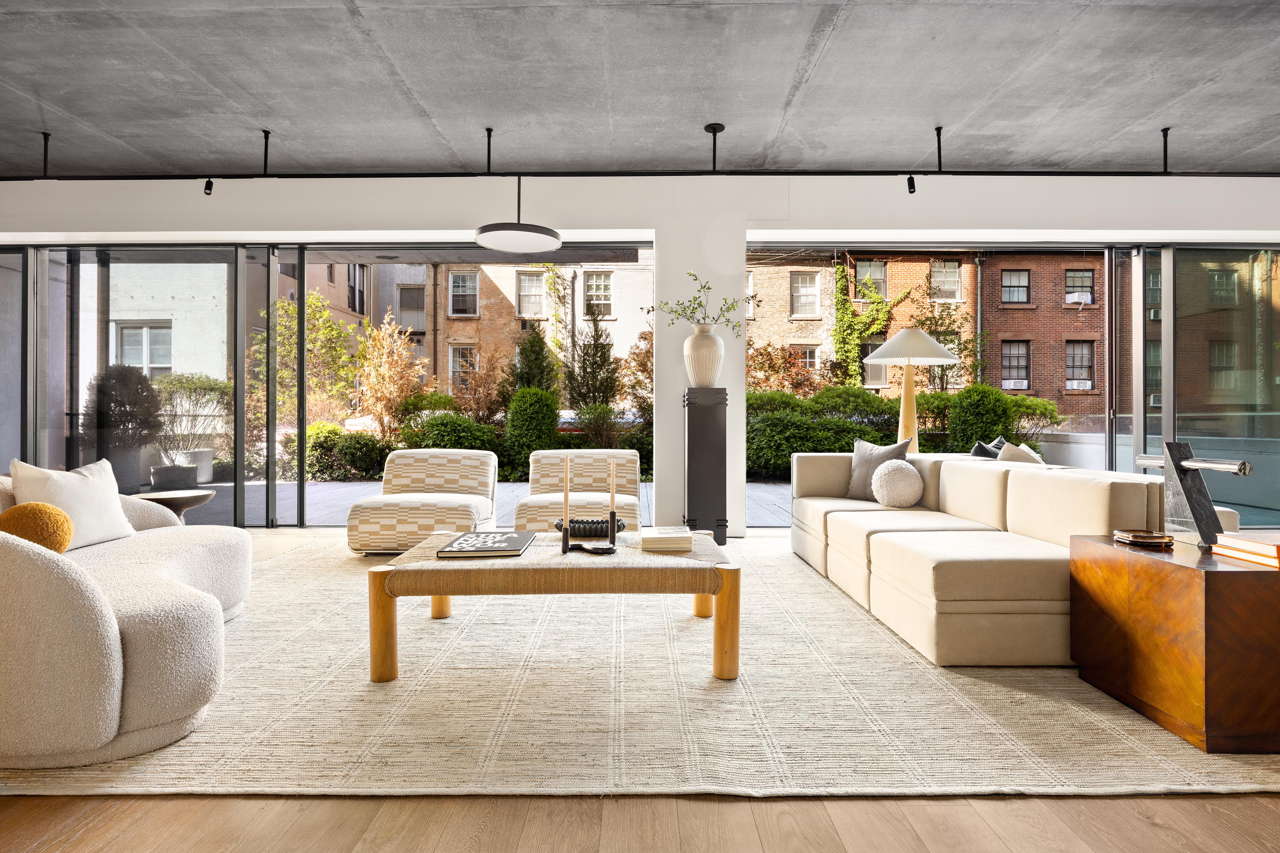 455 West 19th Street, Unit 3 Manhattan, NY 10011 - Photo 15 of 30 a living room with furniture and a large window