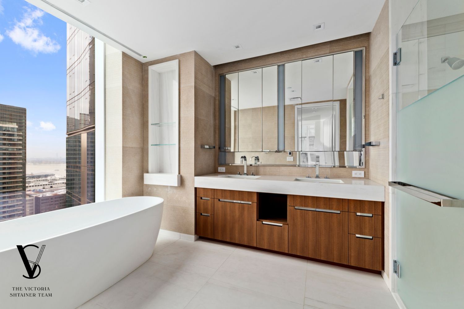 1 West End Avenue, Unit C28 Manhattan, NY 10069 - Photo 9 of 26 a spacious bathroom with a double vanity sink mirror and double