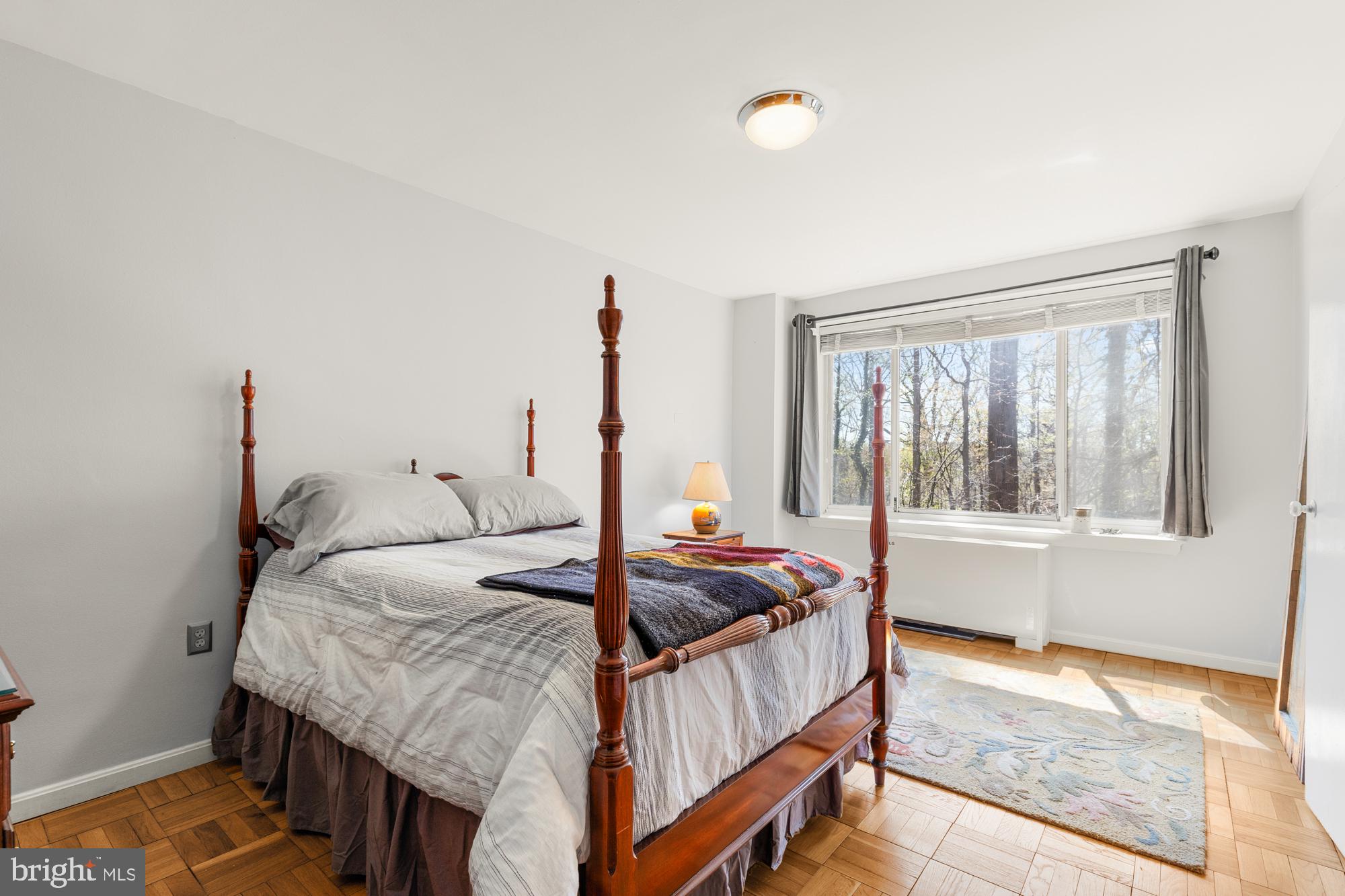 4100 W Street Northwest, Unit 314 Washington, DC 20007 - Photo 17 of 28 a bedroom with a bed and a window