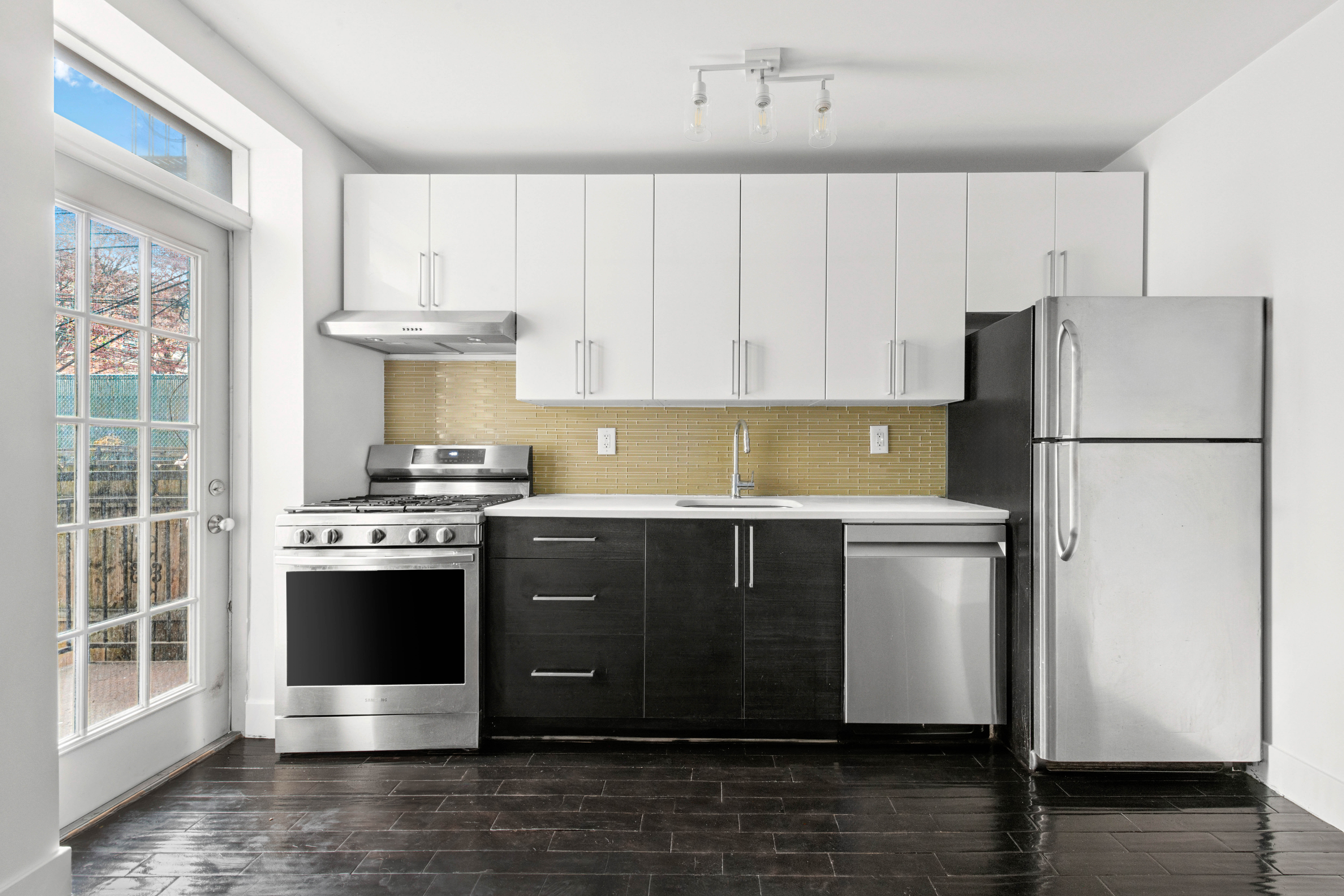 155 A 9th Street, Unit 1 Brooklyn, NY 11231 - Photo 4 of 15 a kitchen with a refrigerator and a stove