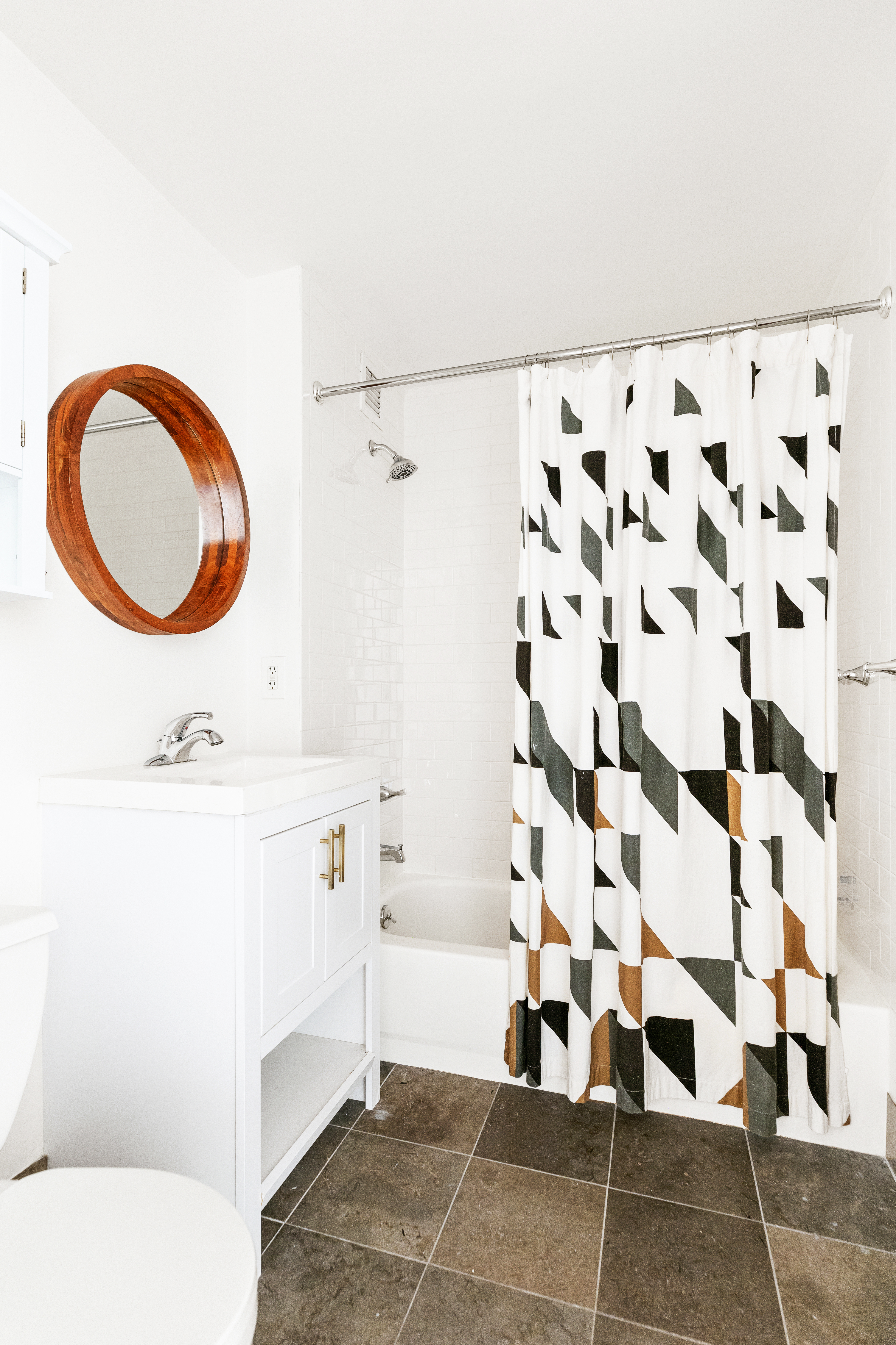 736 West 187th Street, Unit 303 Manhattan, NY 10033 - Photo 11 of 16 a bathroom with a sink a toilet and a shower