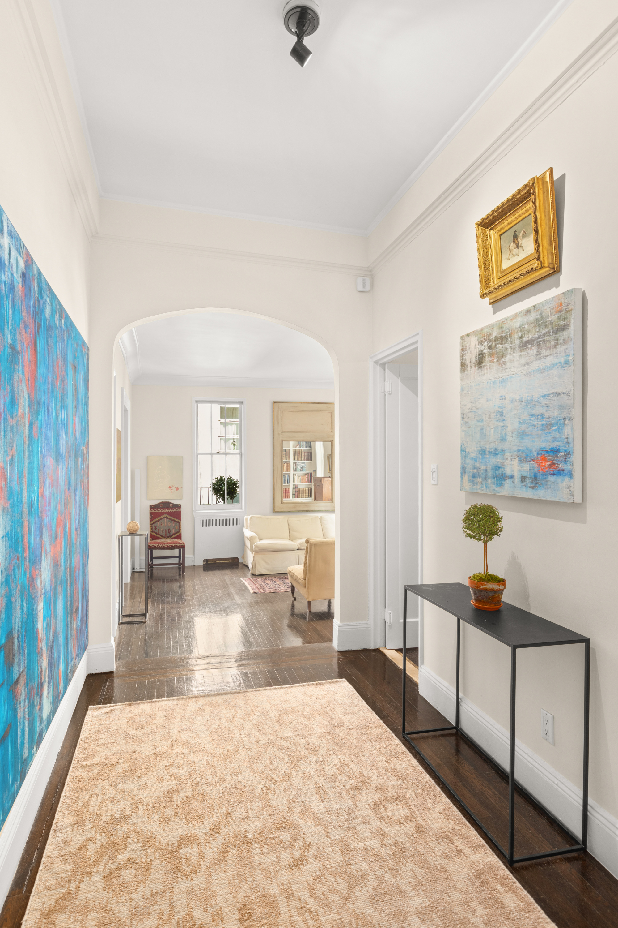 51 East 78th Street, Unit 3BC Manhattan, NY 10075 - Photo 15 of 25 a living room with furniture and a table