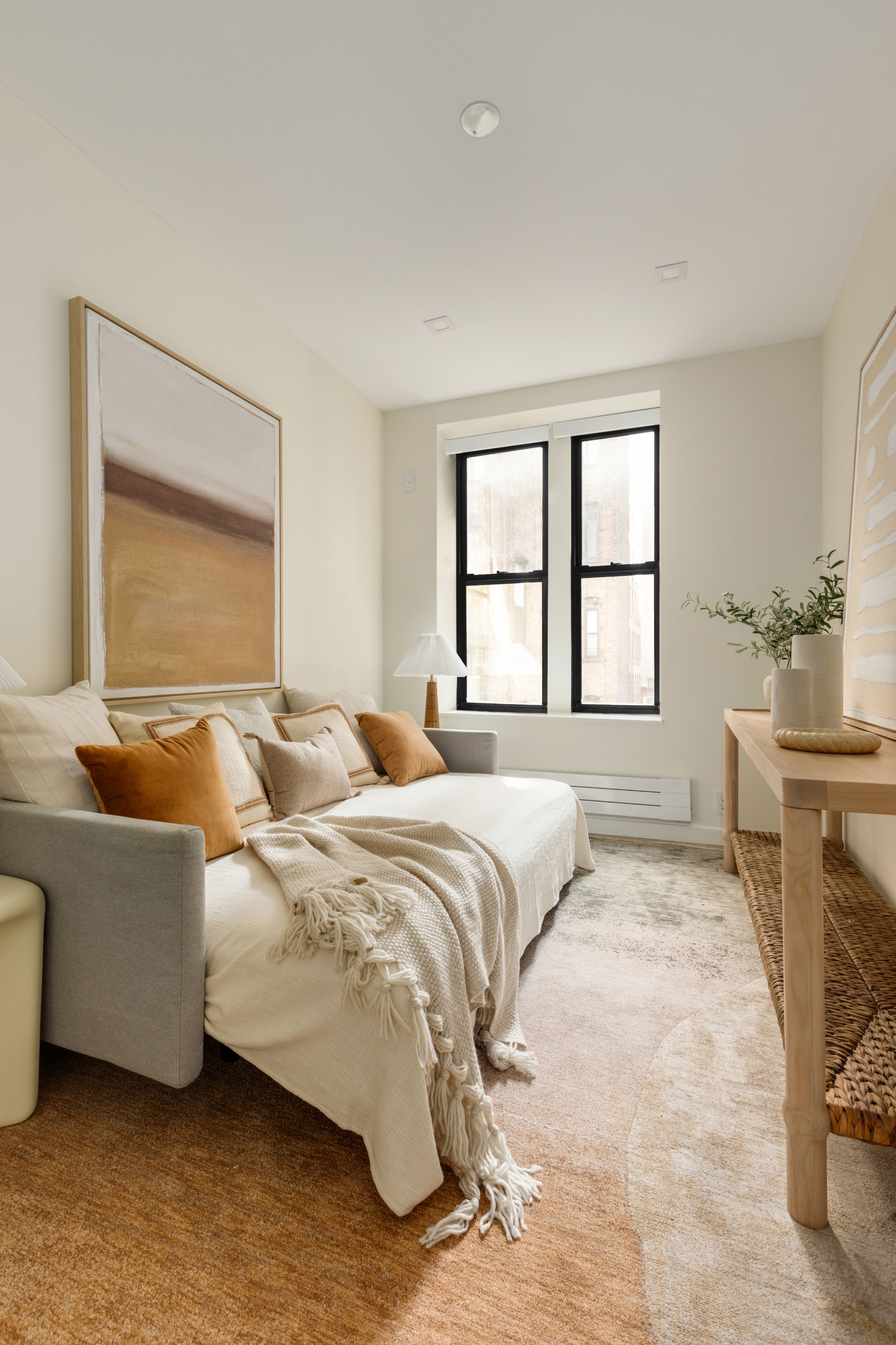 112 Hudson Street, Unit 3 Manhattan, NY 10013 - Photo 7 of 11 a bedroom with a bed and a couch