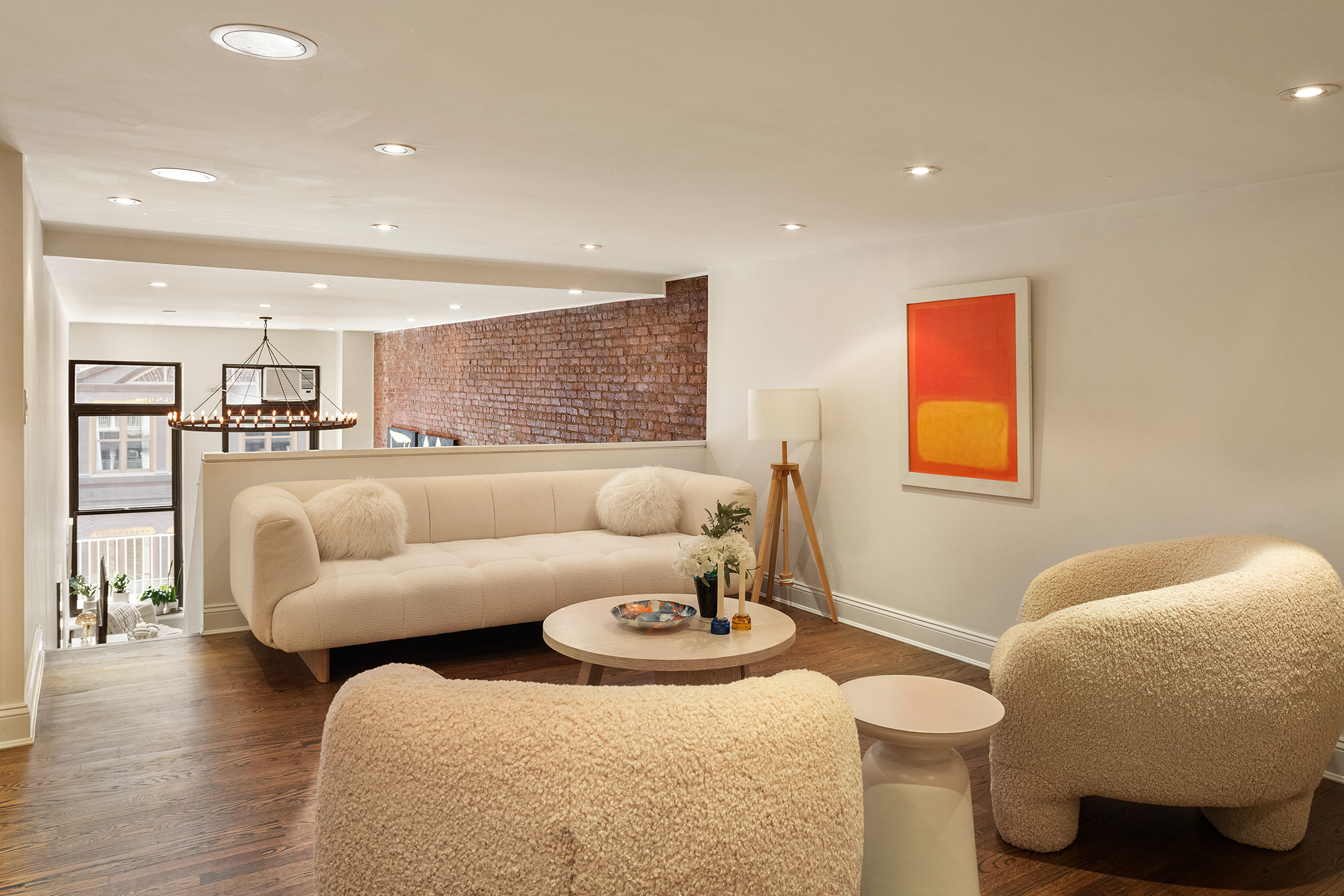 250 Mercer Street, Unit C302 Manhattan, NY 10012 - Photo 12 of 24 a living room with furniture and a table
