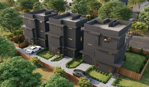 an aerial view of a house with yard