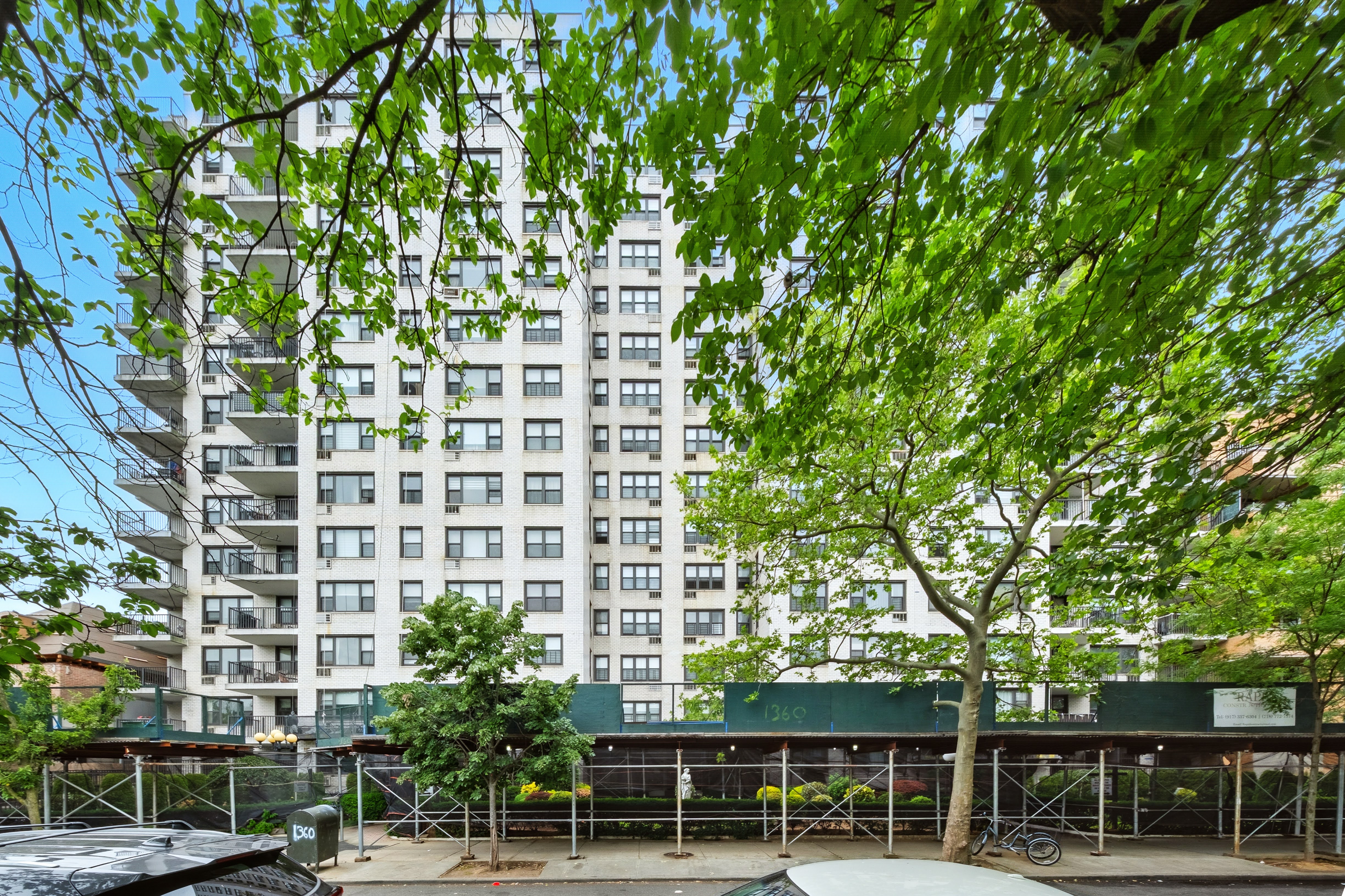 1360 Ocean Parkway, Unit 7B Brooklyn, NY 11230 - Photo 13 of 14 a view of a building with a tree