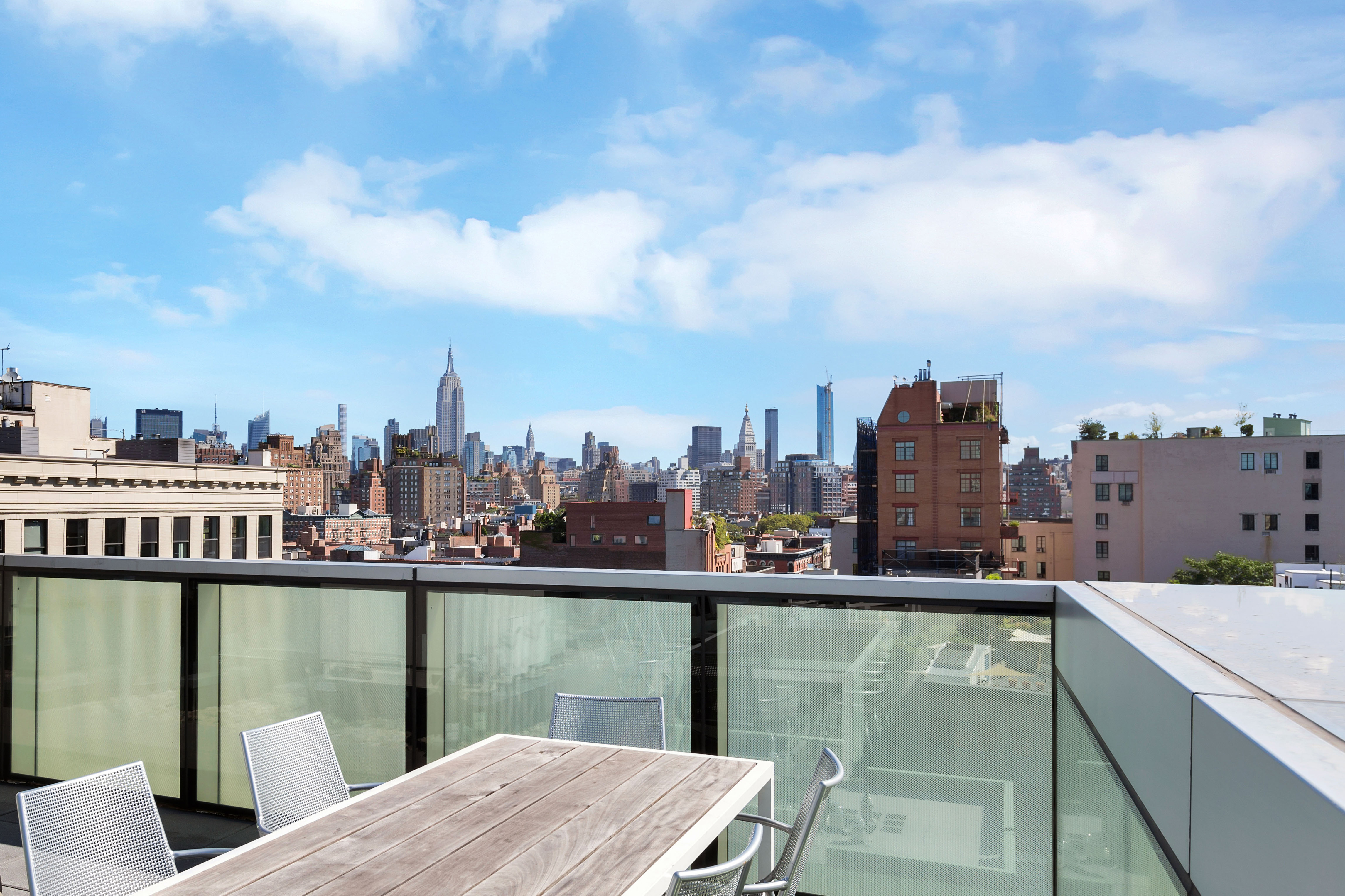 166 Perry Street, Unit 6B Manhattan, NY 10014 - Photo 15 of 17 a view of a city from a lake