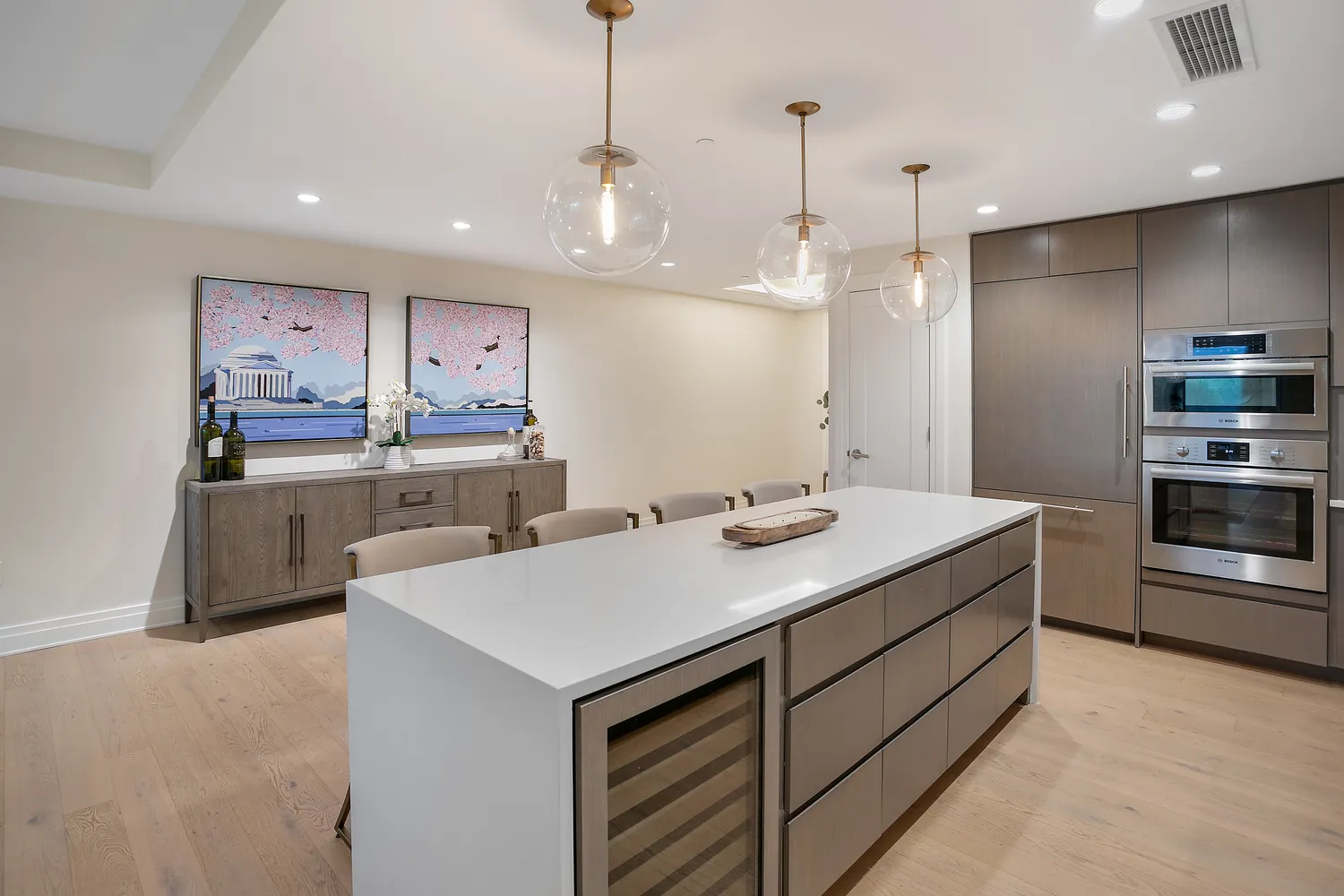 a kitchen with kitchen island a sink stainless steel appliances and cabinets