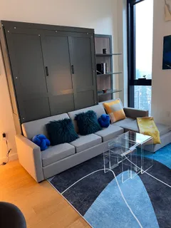 a living room with furniture and a rug