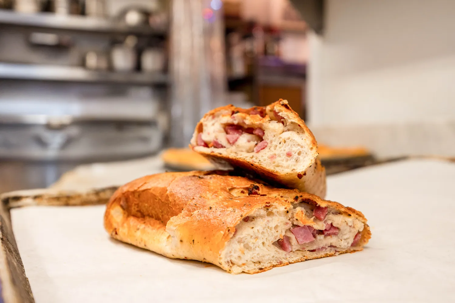 a kitchen with stainless steel appliances granite countertop a sink and wooden floor
