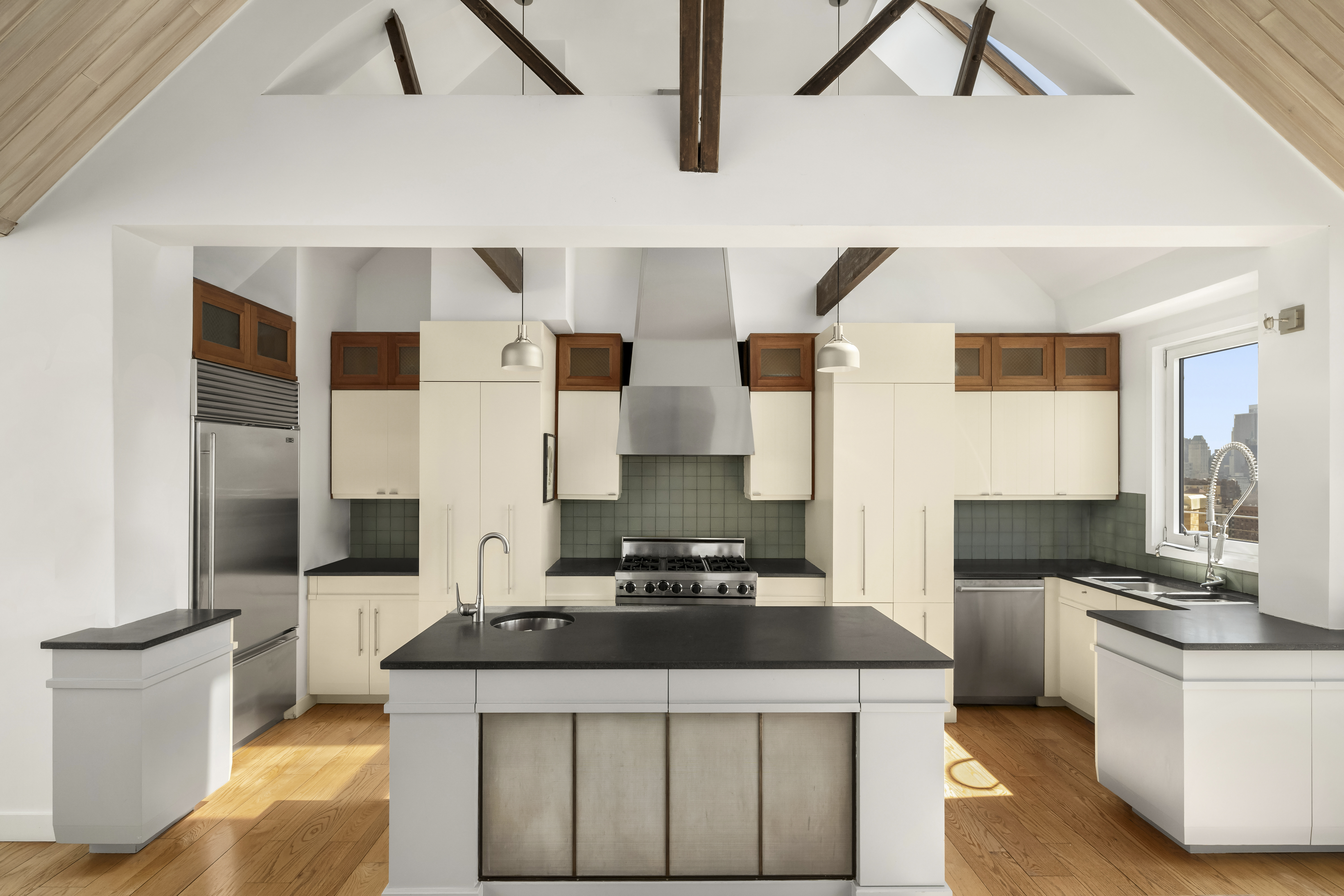 2166 Broadway, Unit PH Manhattan, NY 10024 - Photo 6 of 37 a kitchen with stainless steel appliances granite countertop a stove and a refrigerator