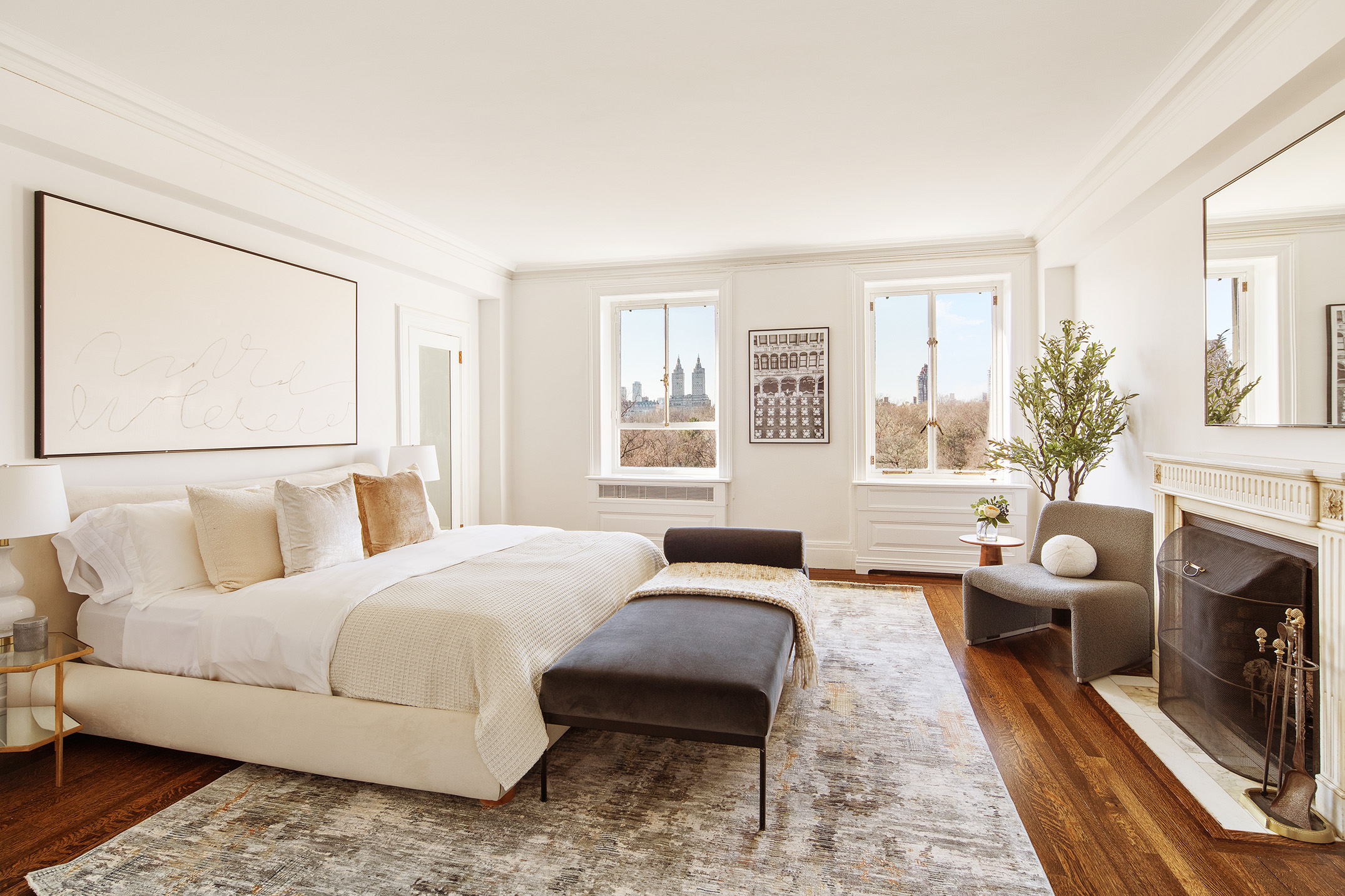 953 5th Avenue, Unit 7/8 Manhattan, NY 10075 - Photo 7 of 15 a bedroom with a large bed couch and a large window