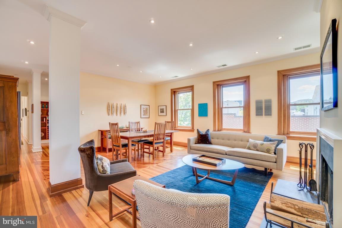 2415 20th Street Northwest, Unit 38 Washington, DC 20009 - Photo 1 of 30 a living room with furniture and a large window