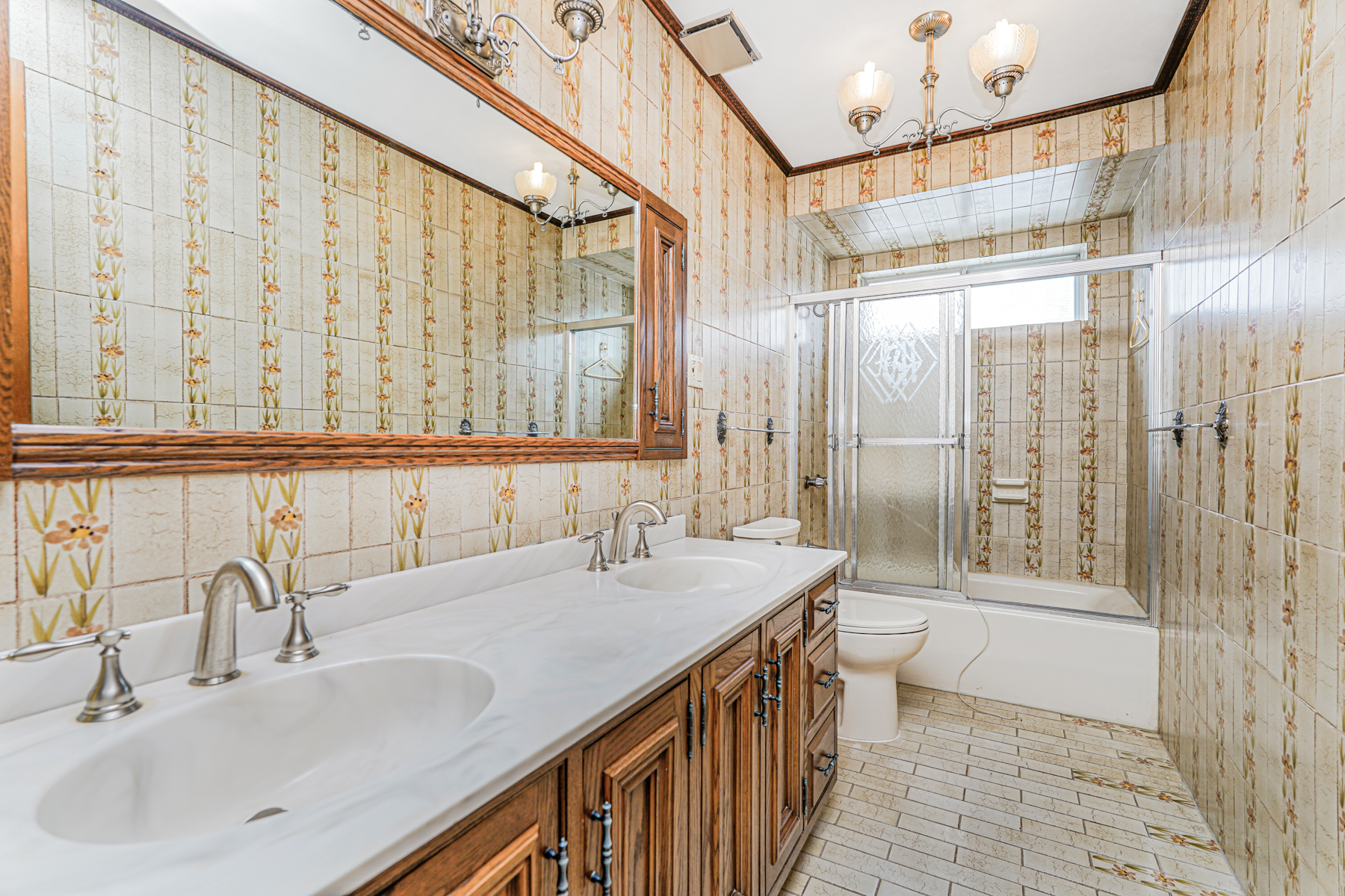 461 Mayfair Drive South Brooklyn, NY 11234 - Photo 18 of 30 a bathroom with a double vanity sink and a mirror