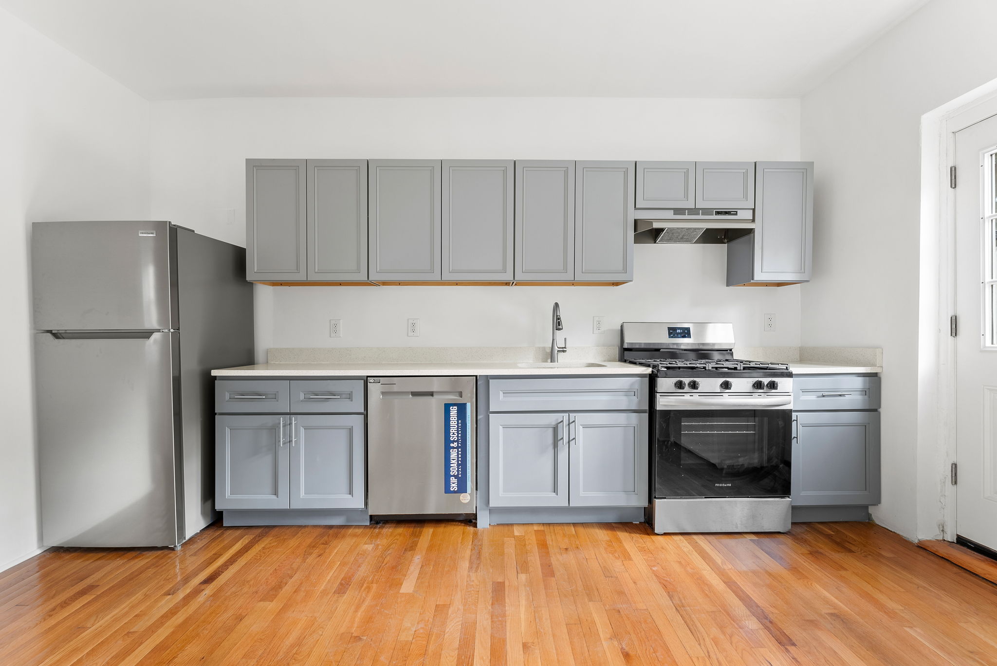 710 Carroll Street Brooklyn, NY 11215 - Photo 2 of 10 a kitchen with stainless steel appliances granite countertop a stove a sink and a refrigerator