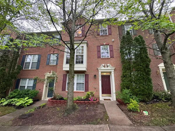 a front view of a multi story residential apartment buildings