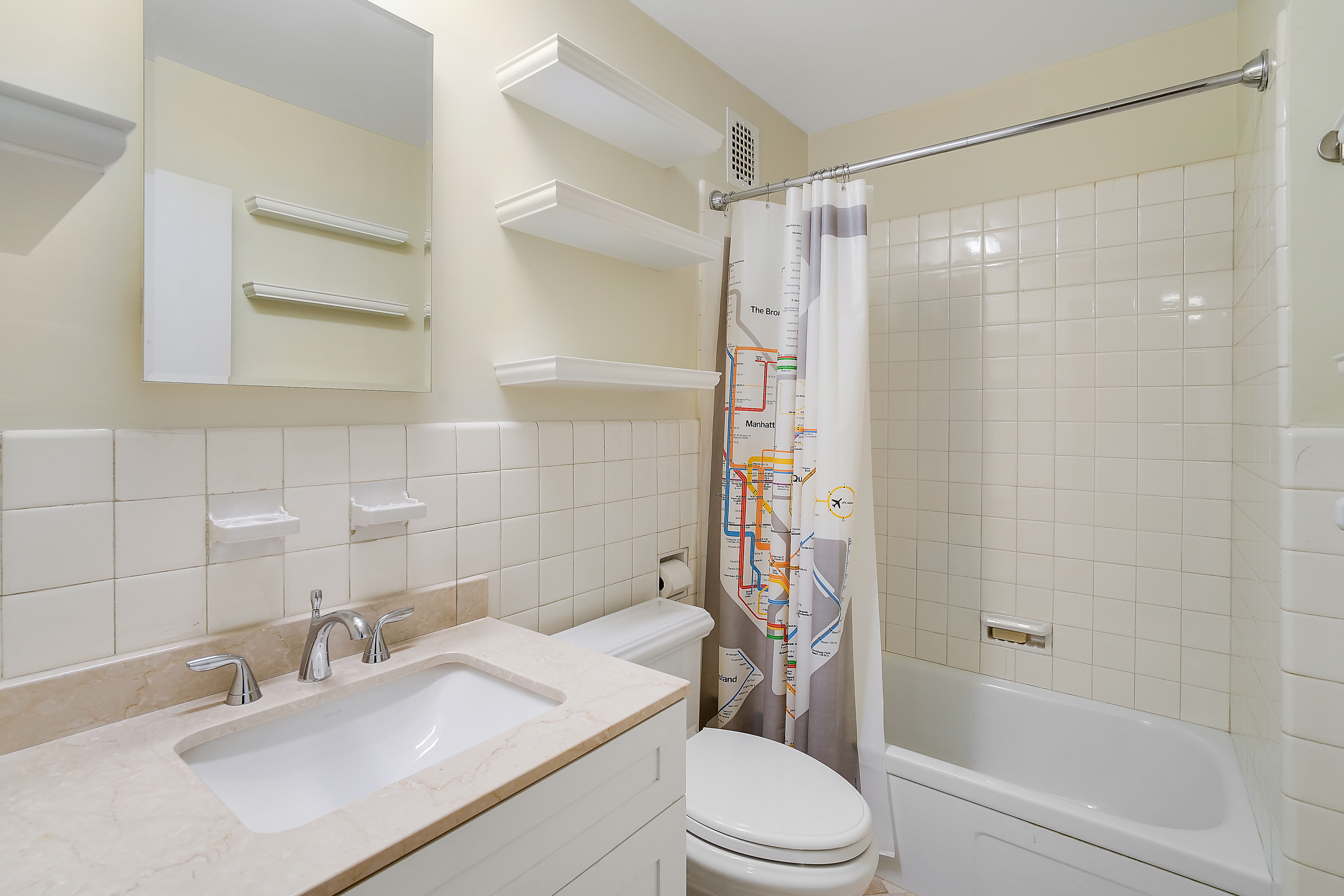 475 Park Avenue, Unit 3D5 Manhattan, NY 10022 - Photo 11 of 18 a bathroom with a sink toilet and shower