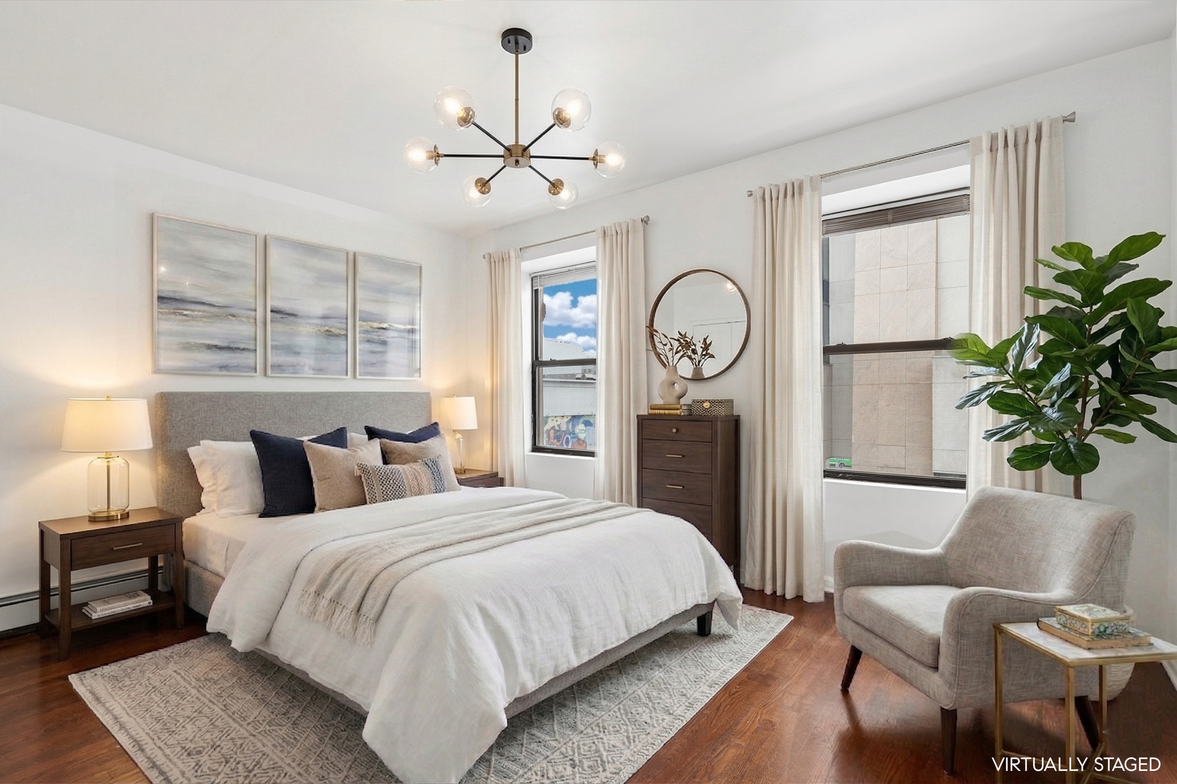 165 West 126th Street Manhattan, NY 10027 - Photo 29 of 40 a bedroom with a bed and a chandelier