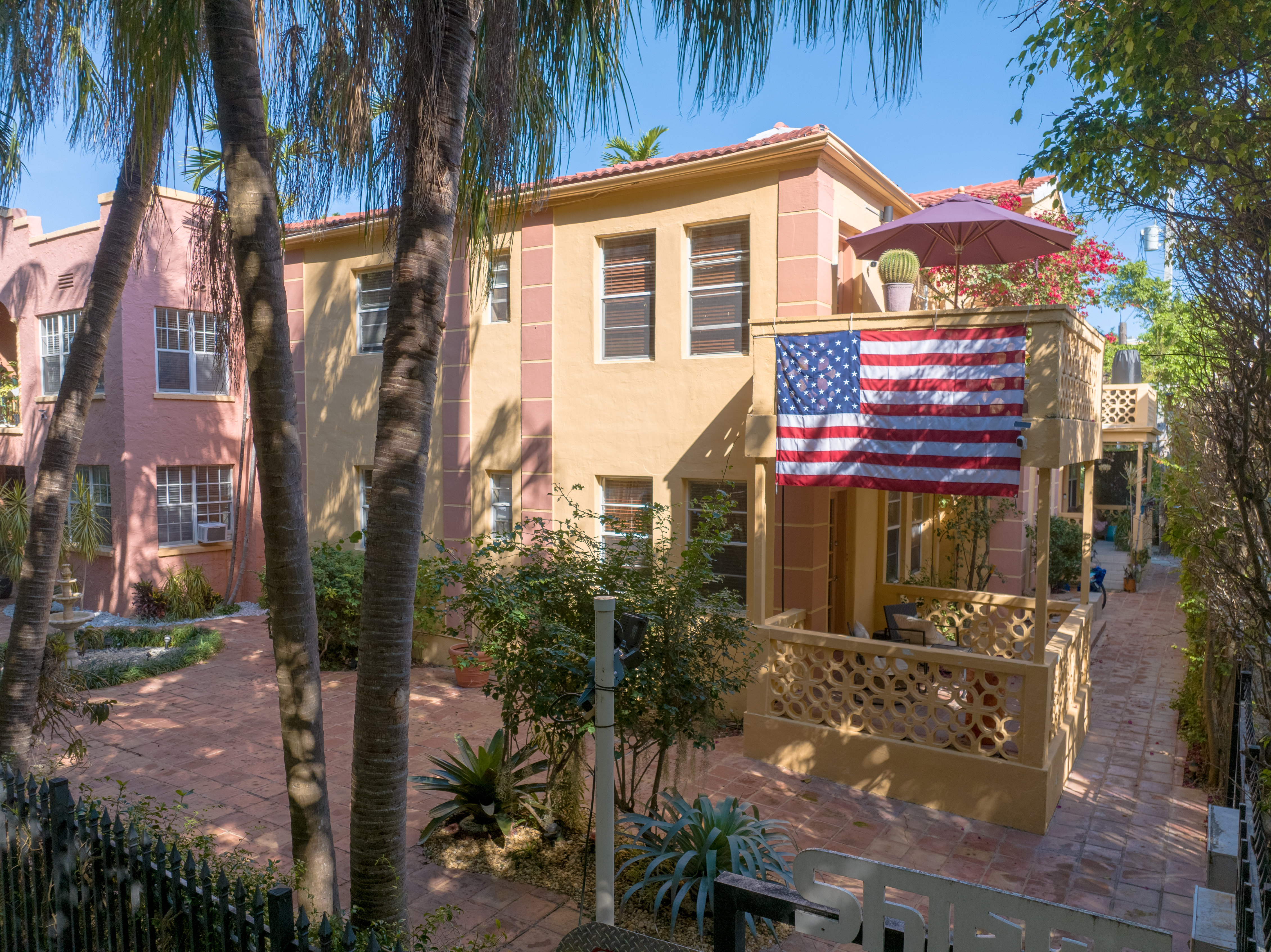 735-745 Meridian Avenue Miami Beach, FL 33139 - Photo 55 of 62 a front view of a house with a yard