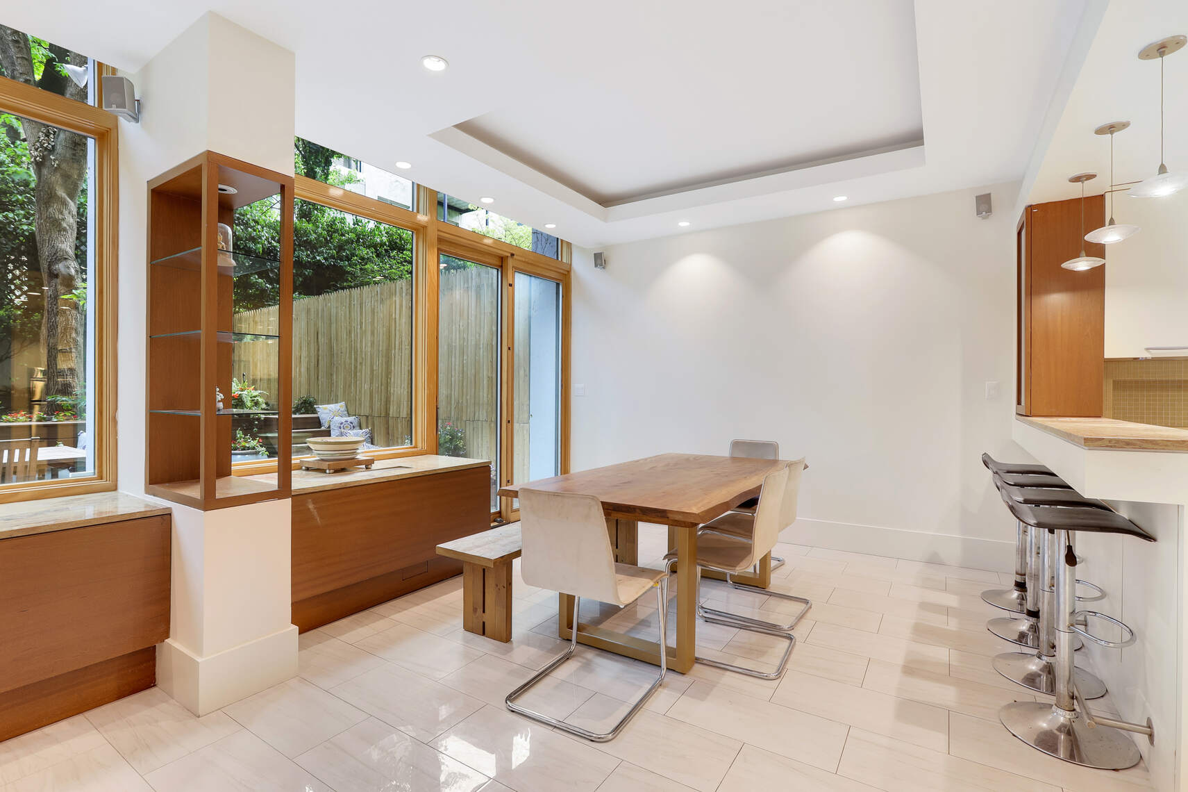 344 West 23rd Street, Unit 1E Manhattan, NY 10011 - Photo 13 of 19 a view of a kitchen with a table and chairs