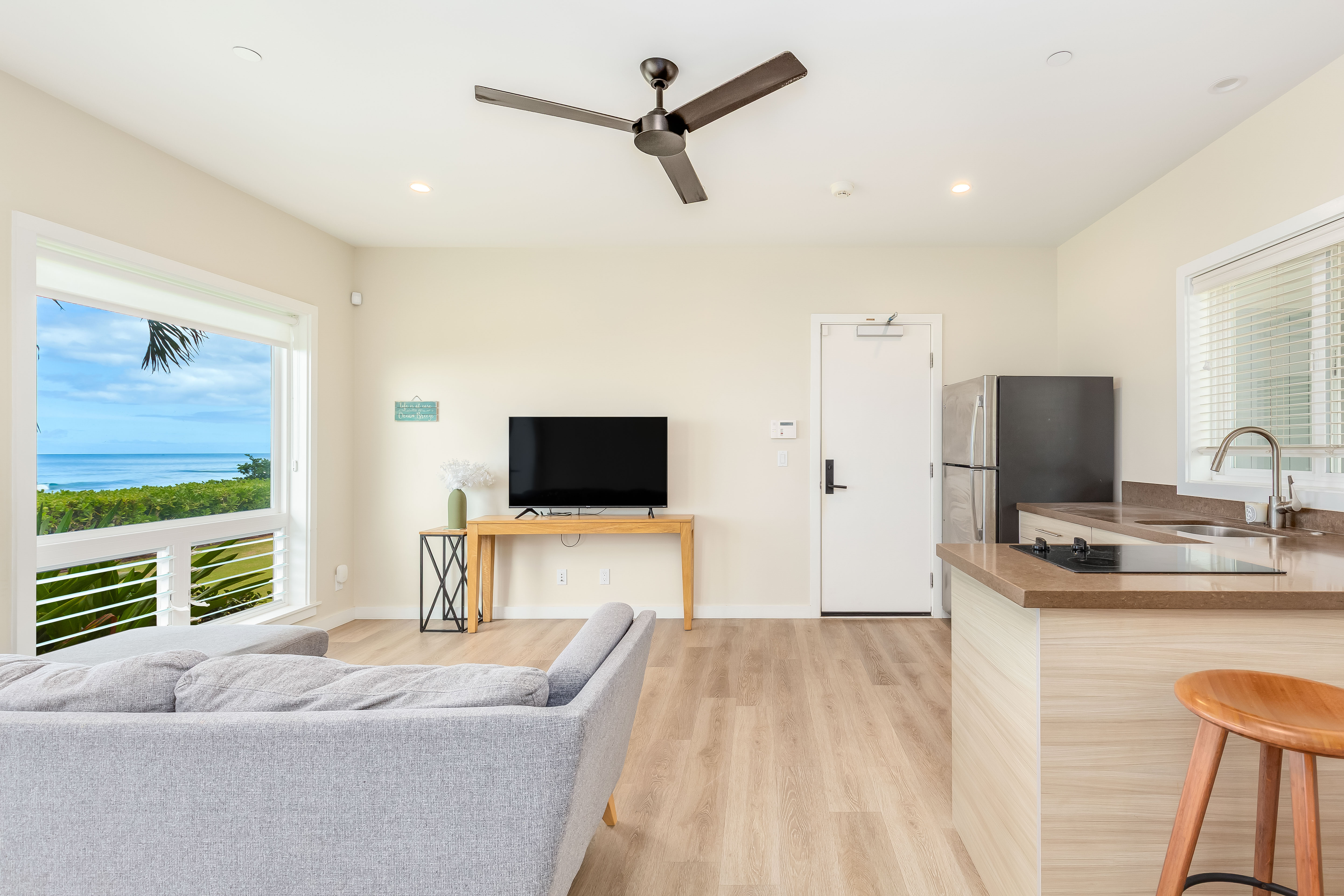 87-849 Farrington Highway, Unit C Waianae, HI 96792 - Photo 17 of 26 a bedroom with a bed and a flat screen tv