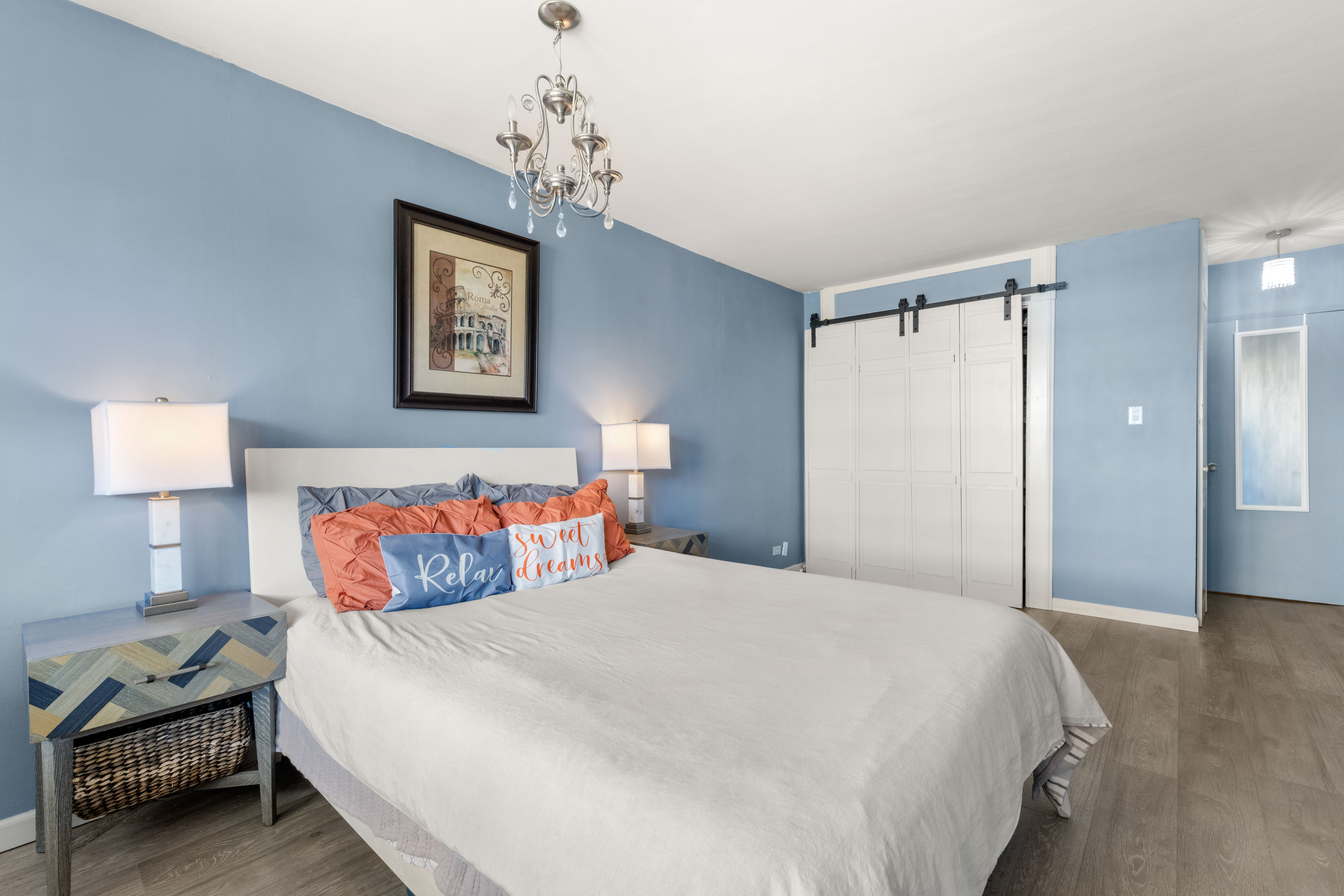 102-30 66th Road, Unit 7E Queens, NY 11375 - Photo 12 of 15 a bedroom with a bed and a lamp