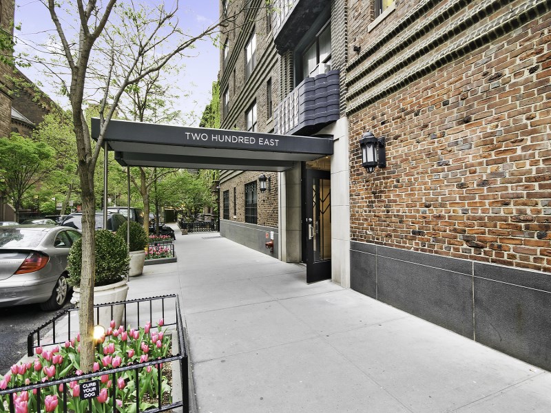 200 East 16th Street, Unit 4A Manhattan, NY 10003 - Photo 5 of 6 a view of a patio with couches and table under an umbrella