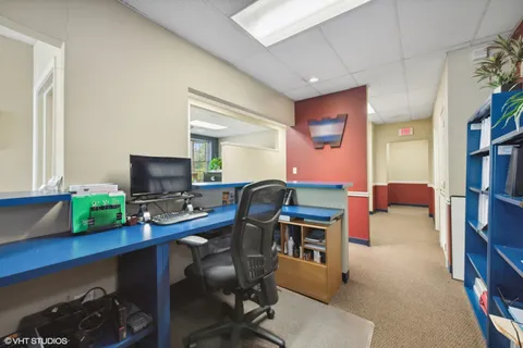 a view of a workspace with furniture