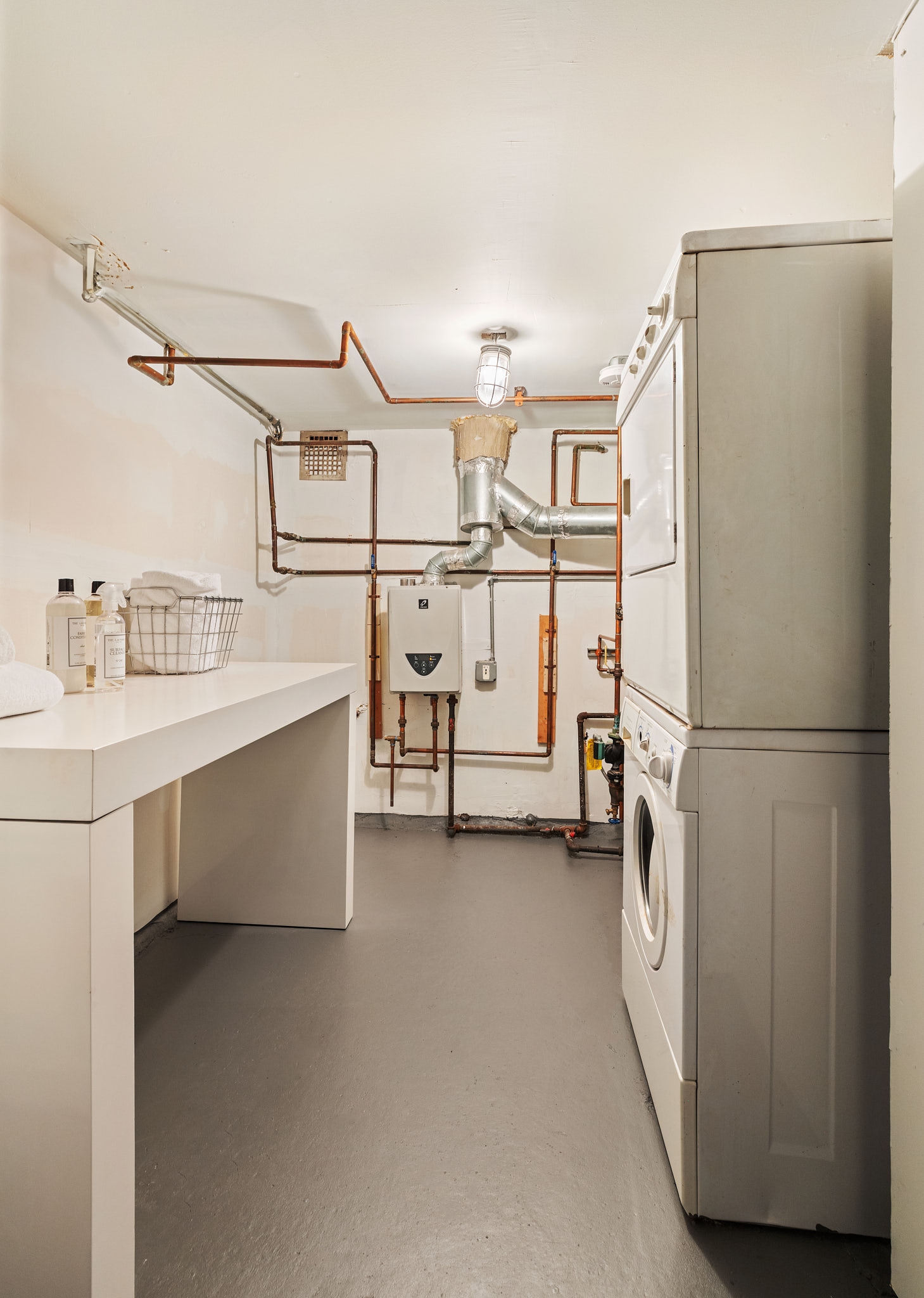 377 West 11th Street, Unit 1D Manhattan, NY 10014 - Photo 20 of 22 a utility room with dryer and washer