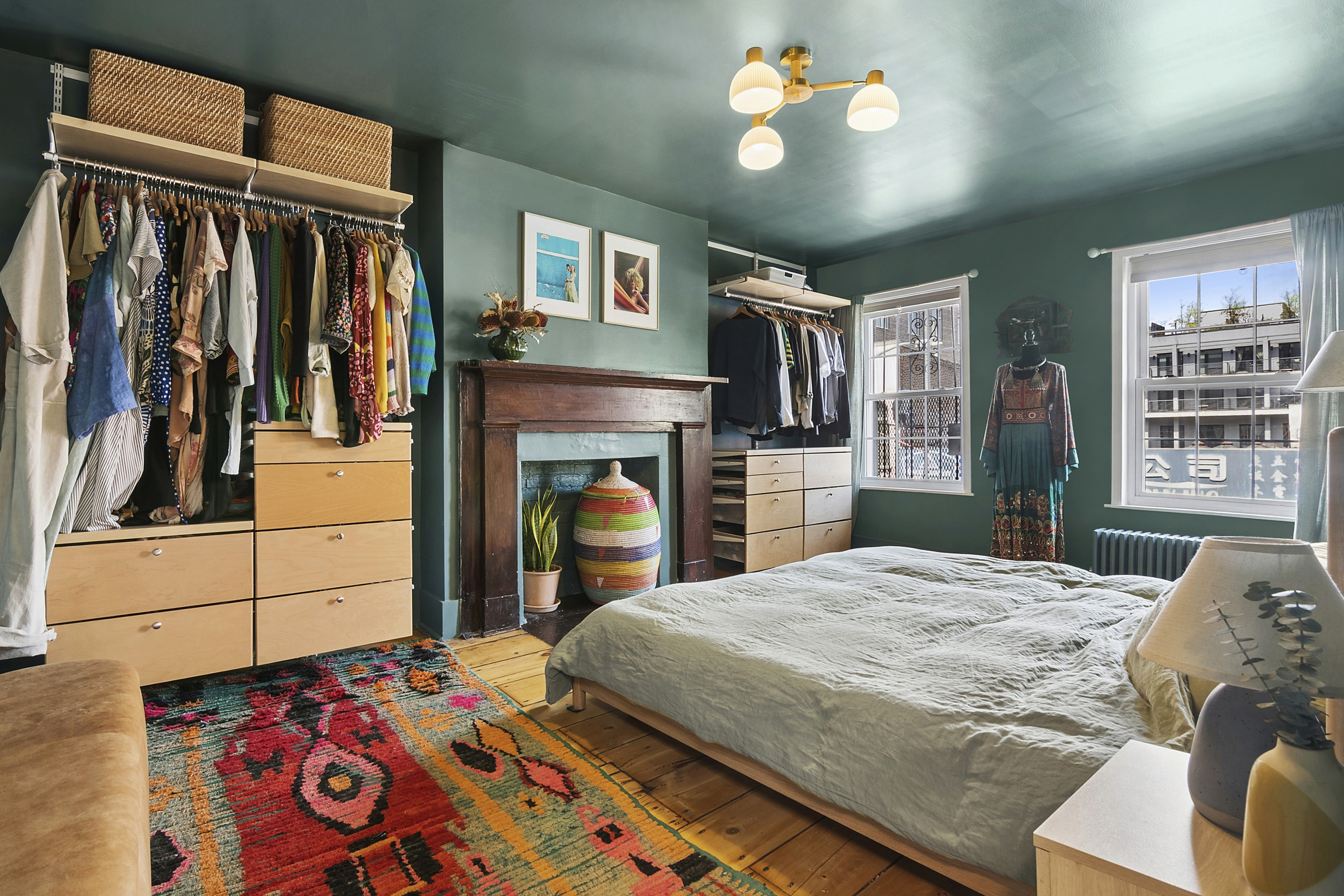 190 Concord Street Brooklyn, NY 11201 - Photo 8 of 14 a bedroom with a bed and a chandelier