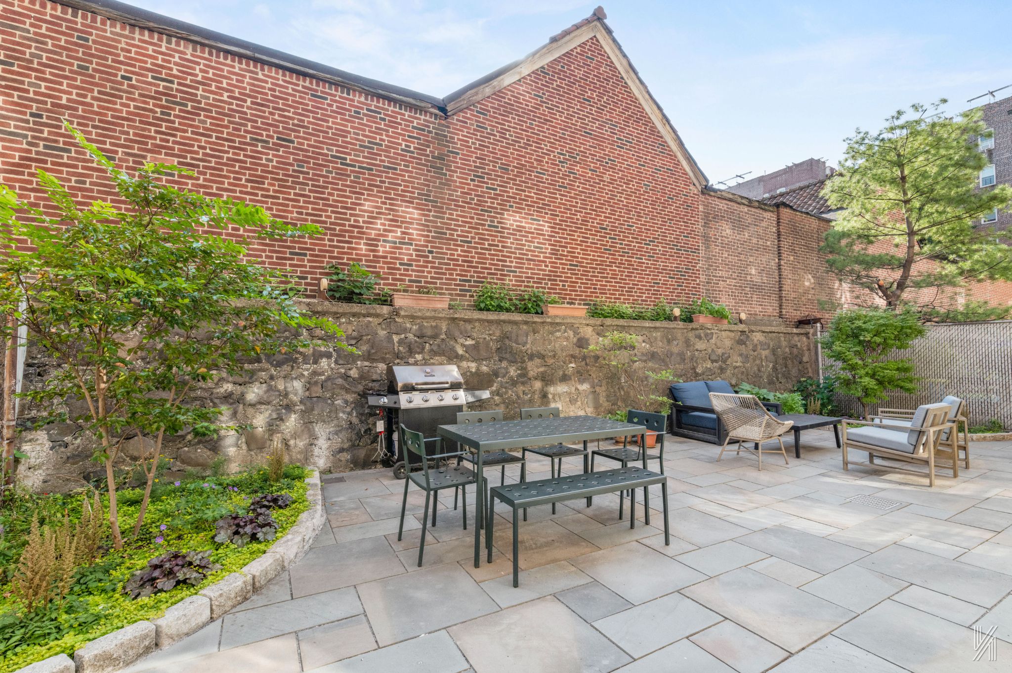 34-39 82nd Street, Unit 52 Queens, NY 11372 - Photo 15 of 18 a view of a patio with table and chairs and potted plants
