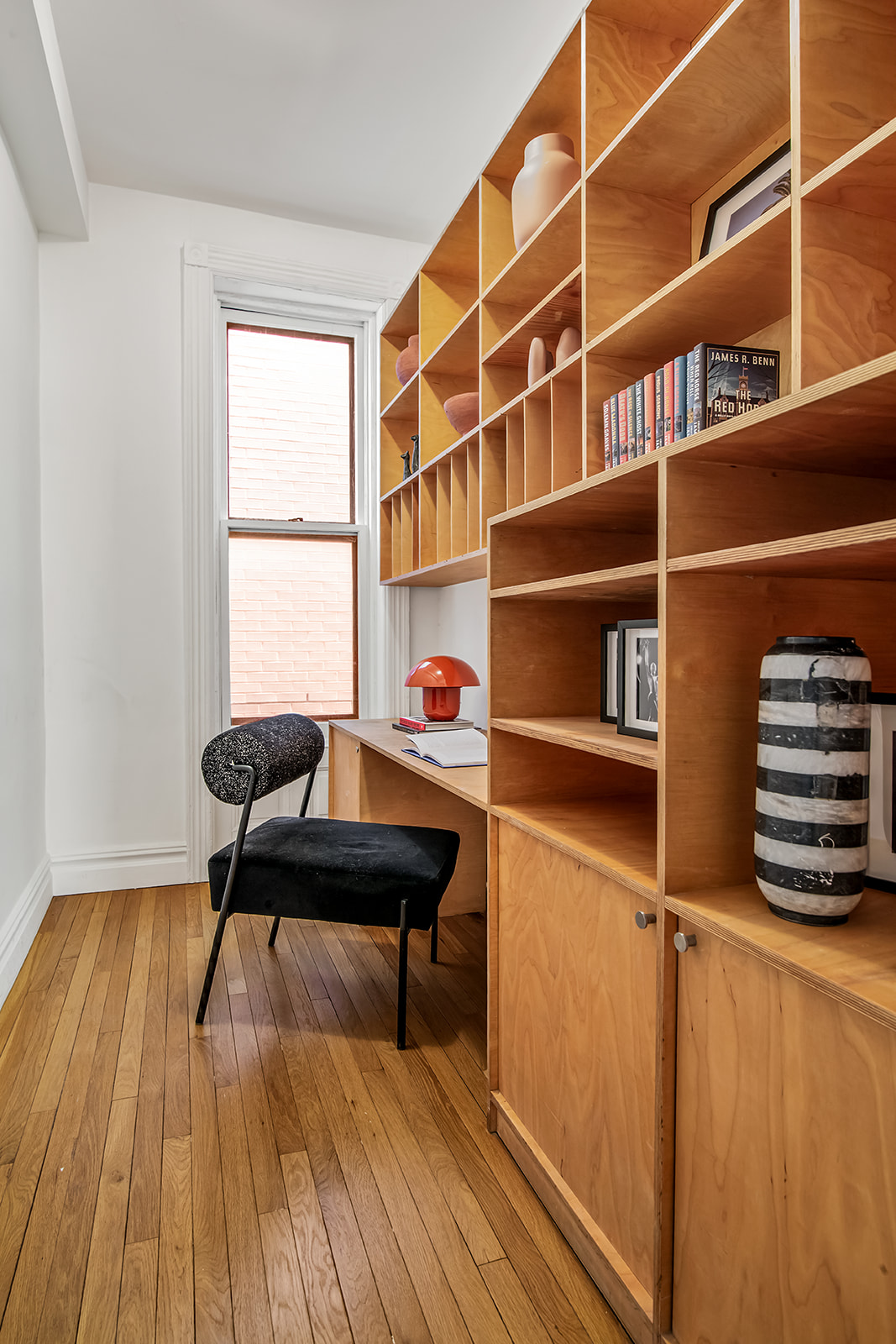 39 1/2 Washington Square South, Unit 9 Manhattan, NY 10012 - Photo 9 of 12 a workspace with wooden floor and a window