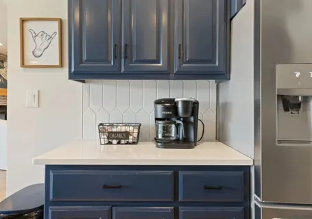 a bathroom with double vanity sinks and a mirror