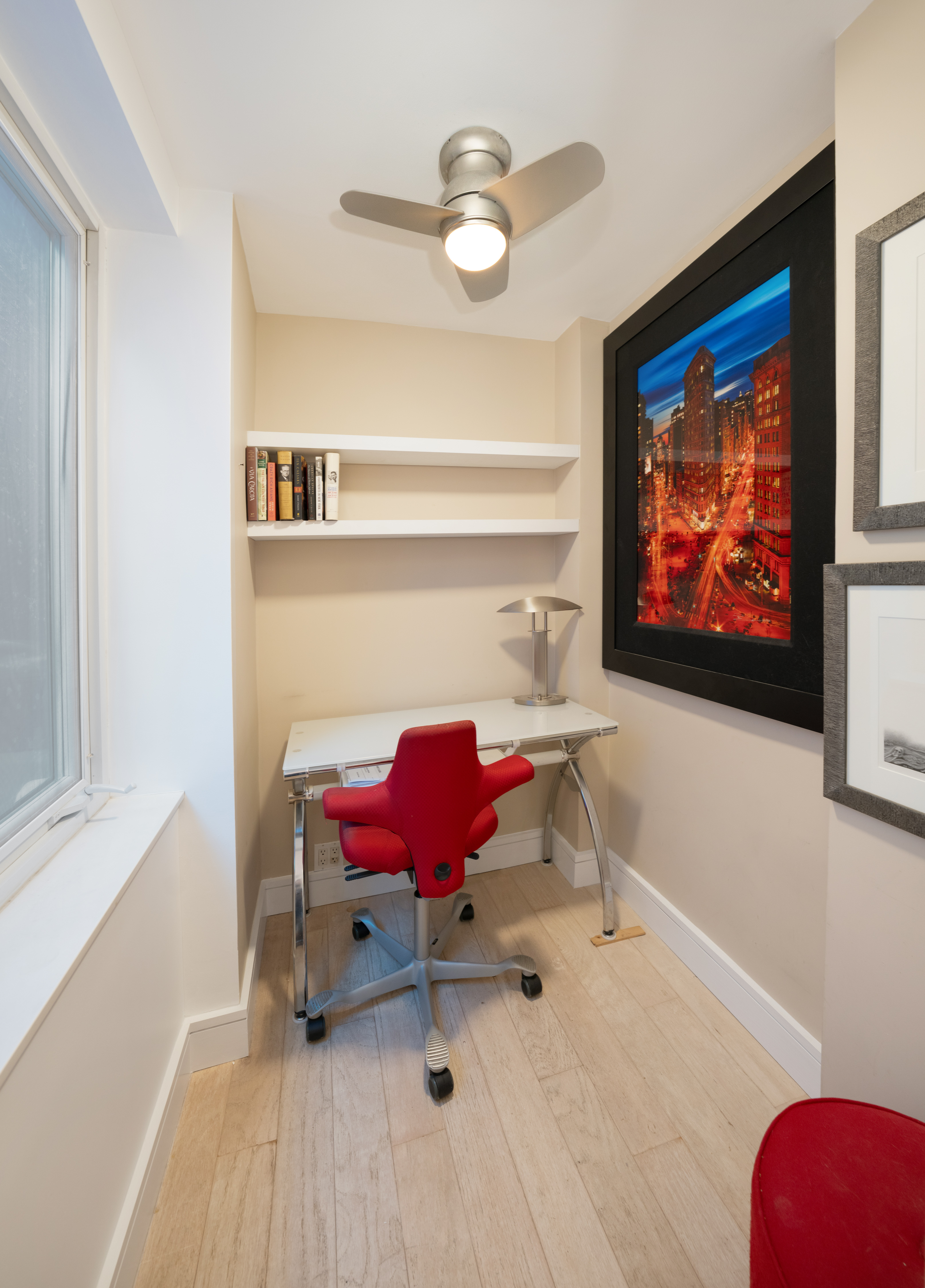 314 East 41st Street, Unit PH2B Manhattan, NY 10017 - Photo 10 of 13 a living room with furniture and a flat screen tv