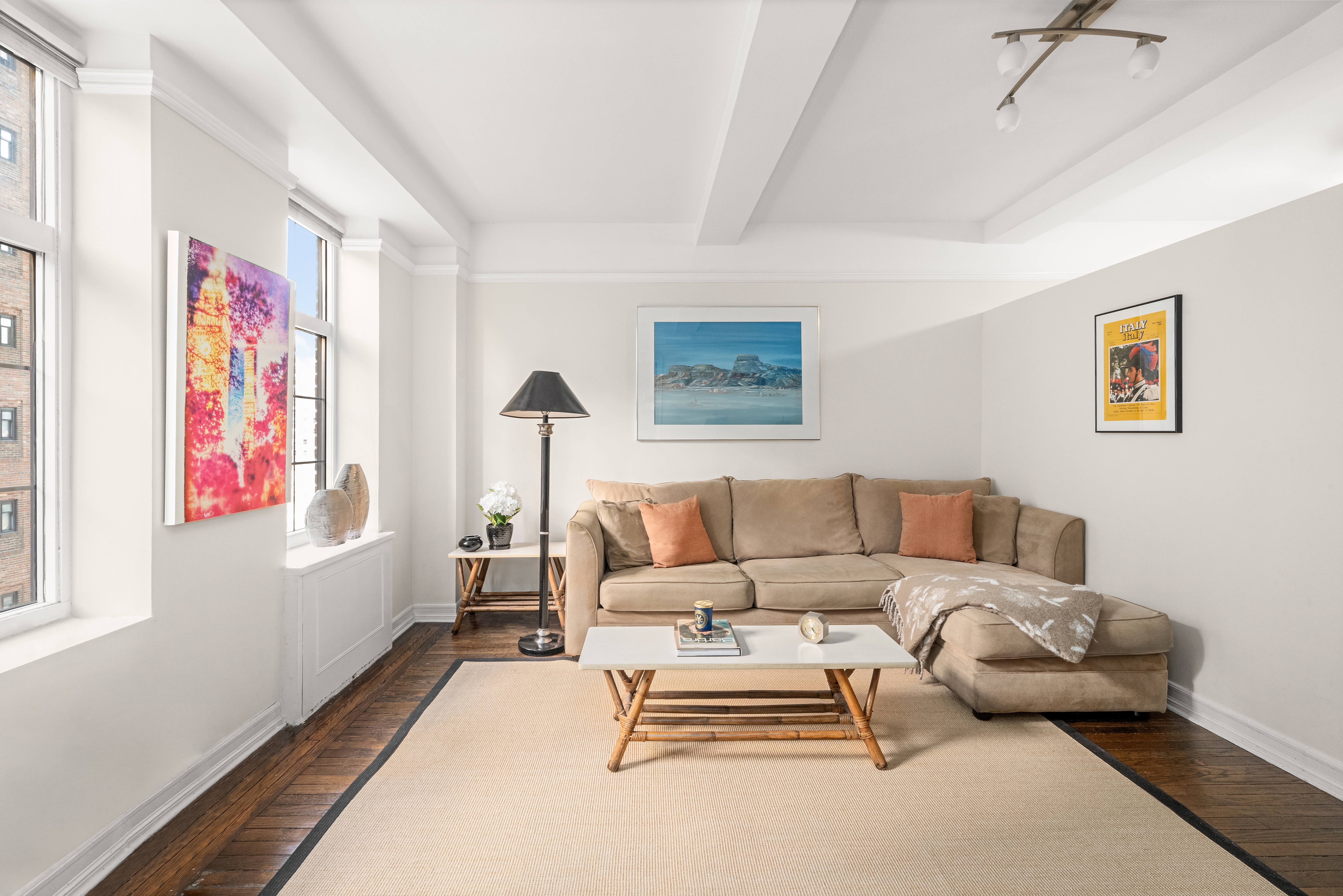 405 West 23rd Street, Unit 9I Manhattan, NY 10011 - Photo 3 of 10 a living room with furniture and a window
