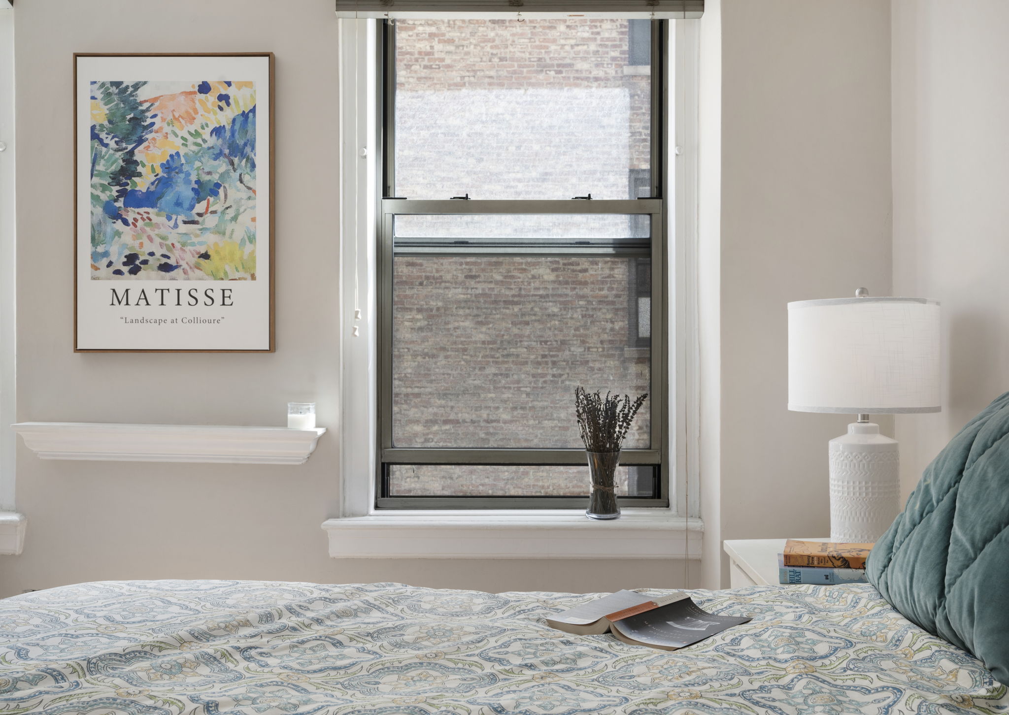 136 East 36th Street, Unit 5D Manhattan, NY 10016 - Photo 6 of 13 a view of a bedroom with wooden floor and a window